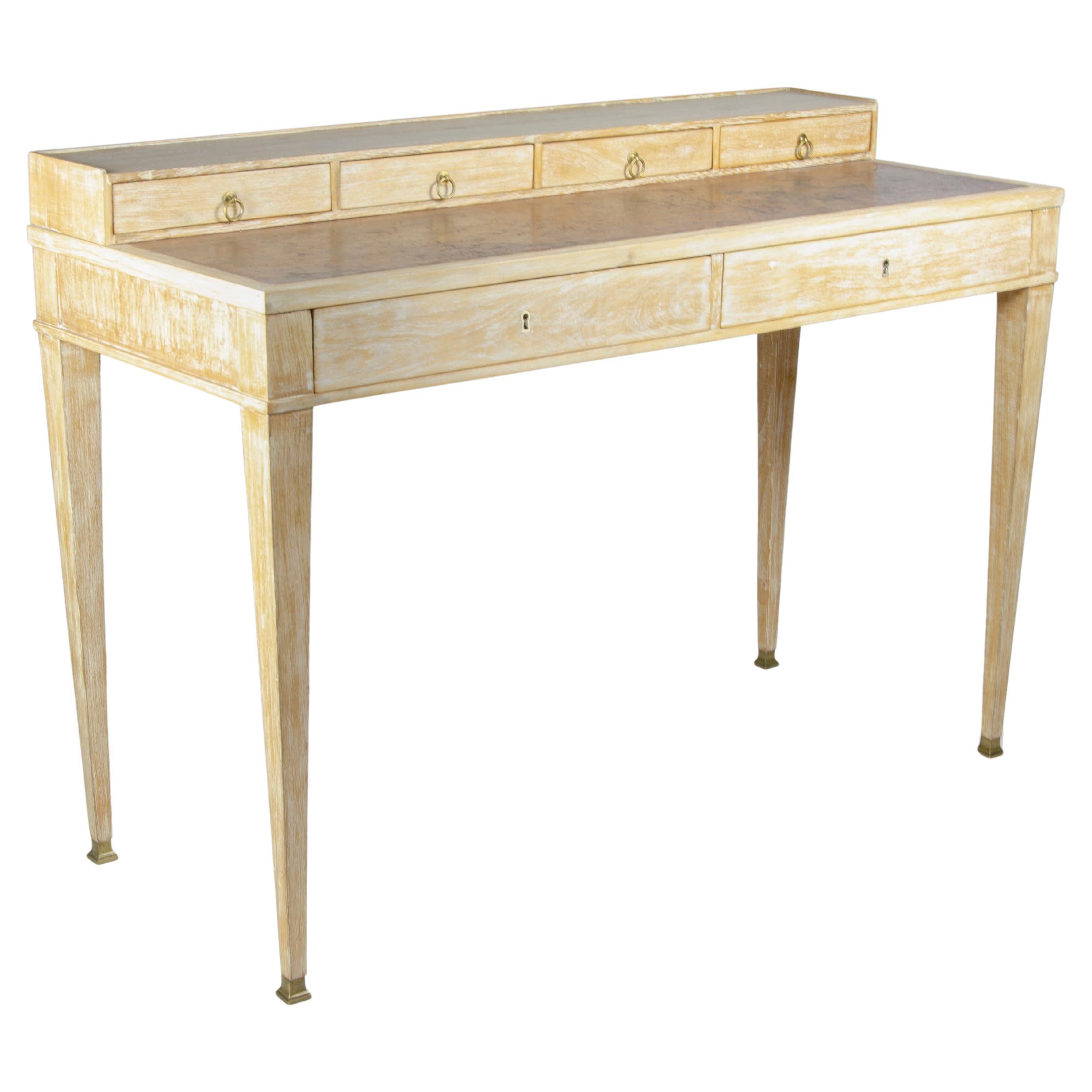 A rare oak decapé desk by Jean-Michel Frank.