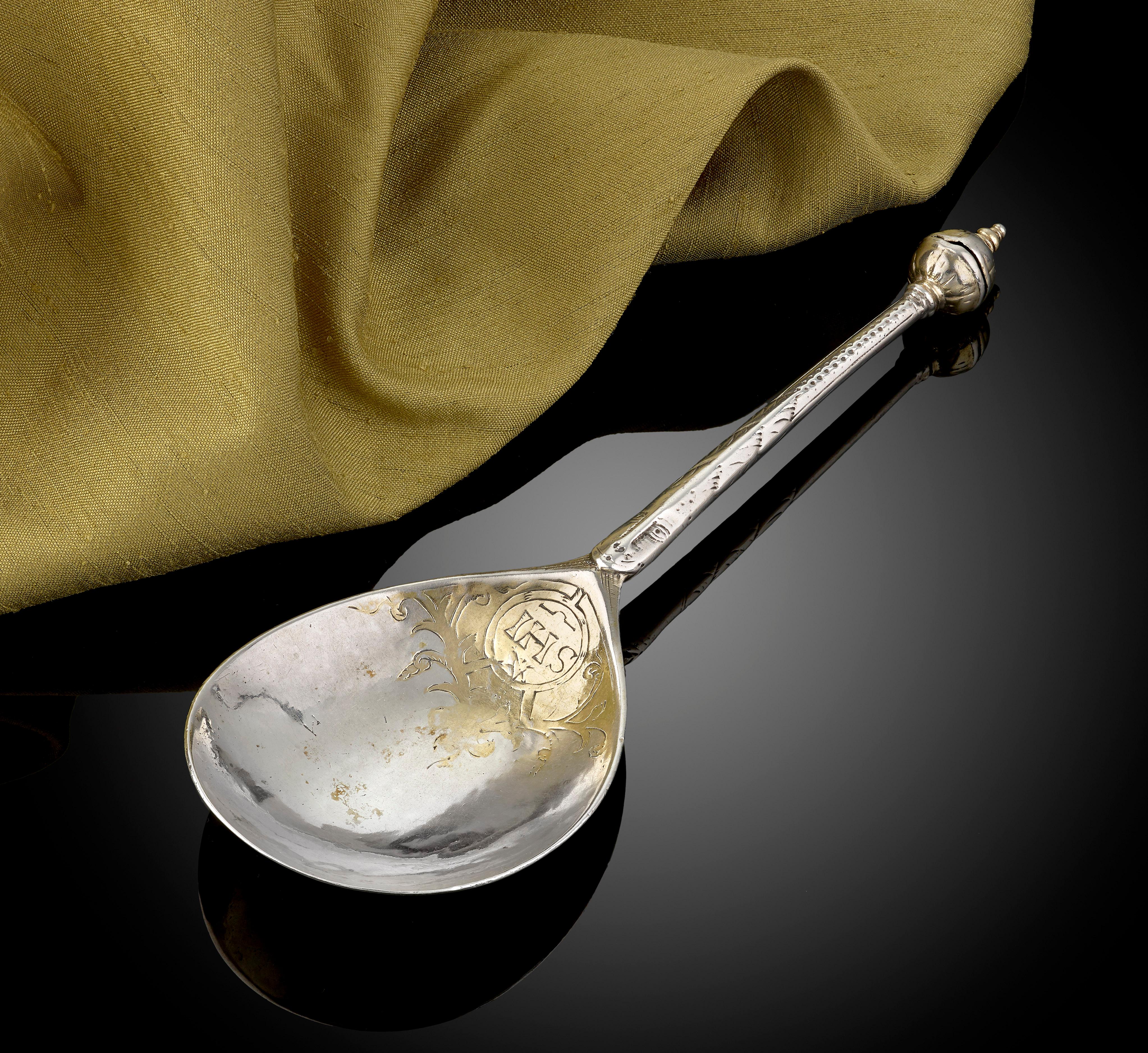 A rare early Norwegian silver and parcel gilt spoon, circa 1590; with a' ball knop', and the stem decorated with a face; IHS monogram in the bowl. For a spoon of similar style see '100 Norske Solverskjeer' by Hans Johan Storesund -Spoon No.2. The
