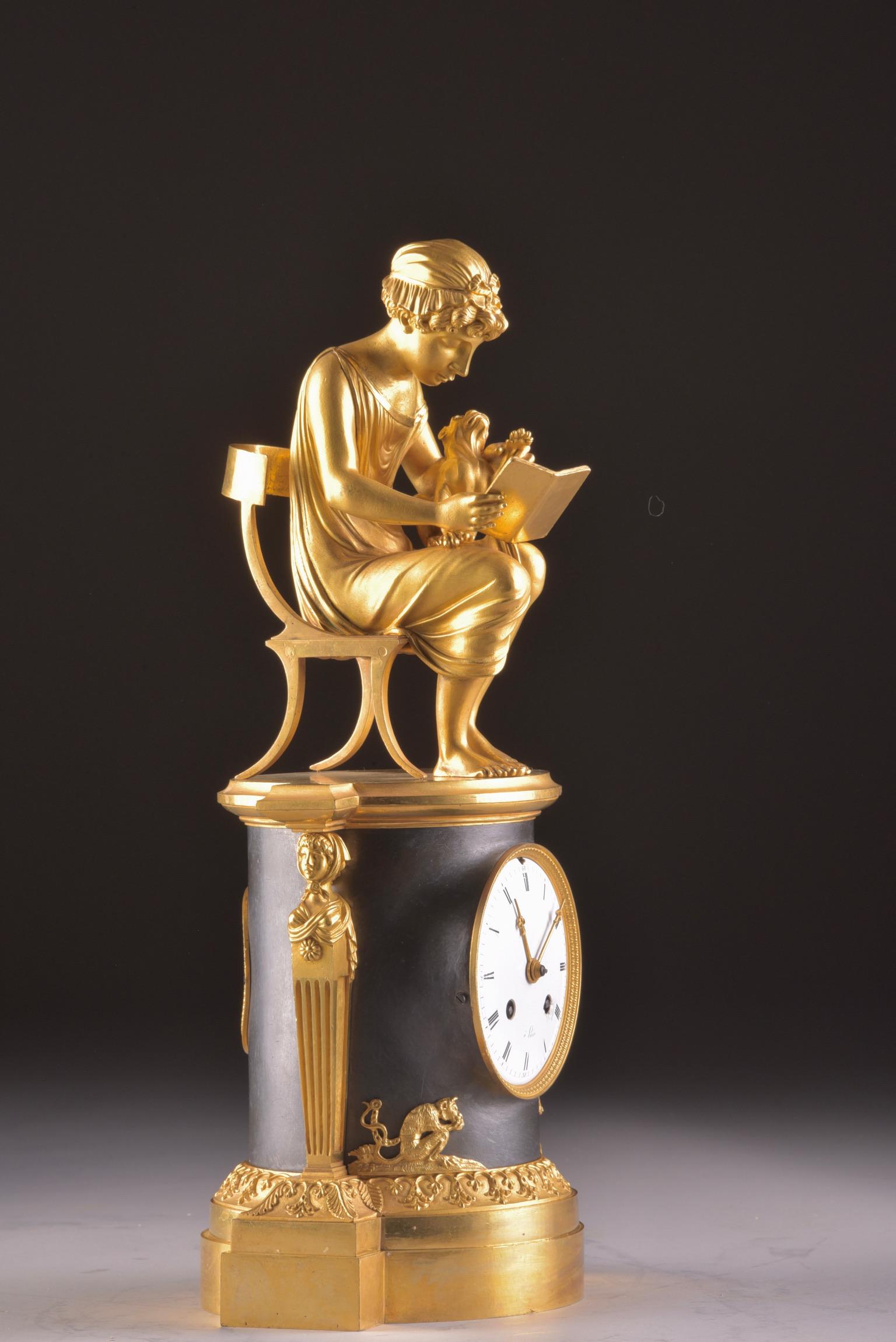 Exceptional beautiful rare French, ''Library'' in the style of Claude Galle (1759-1816).
Dated circa 1810-1815. With the image of a young girl sitting at the stoel and reading a book, with her dog on her lap. The clock is further decorated with two