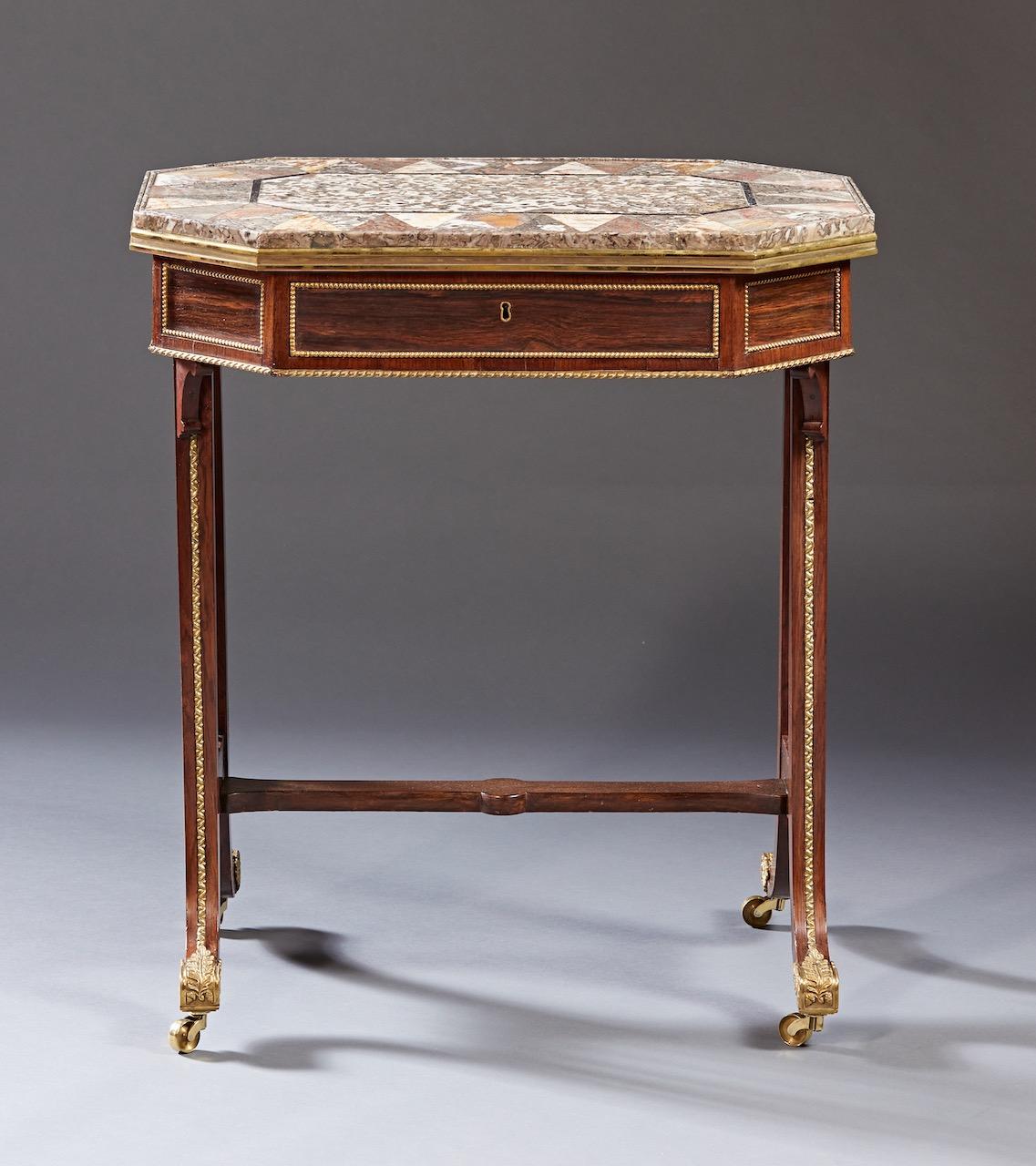 A rare and possibly unique drinks or serving side table attributed to Gillows of London and Lancaster. The specimen inlaid marble top rests on a conforming octagonal shaped case in rosewood with a single drawer on 