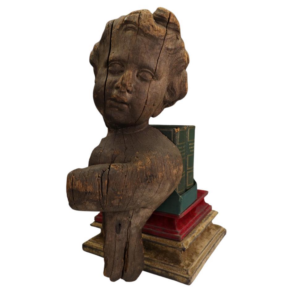 A Rare French Carved Architectural Fragment: Baroque Putto Head from Rouen Cathe For Sale