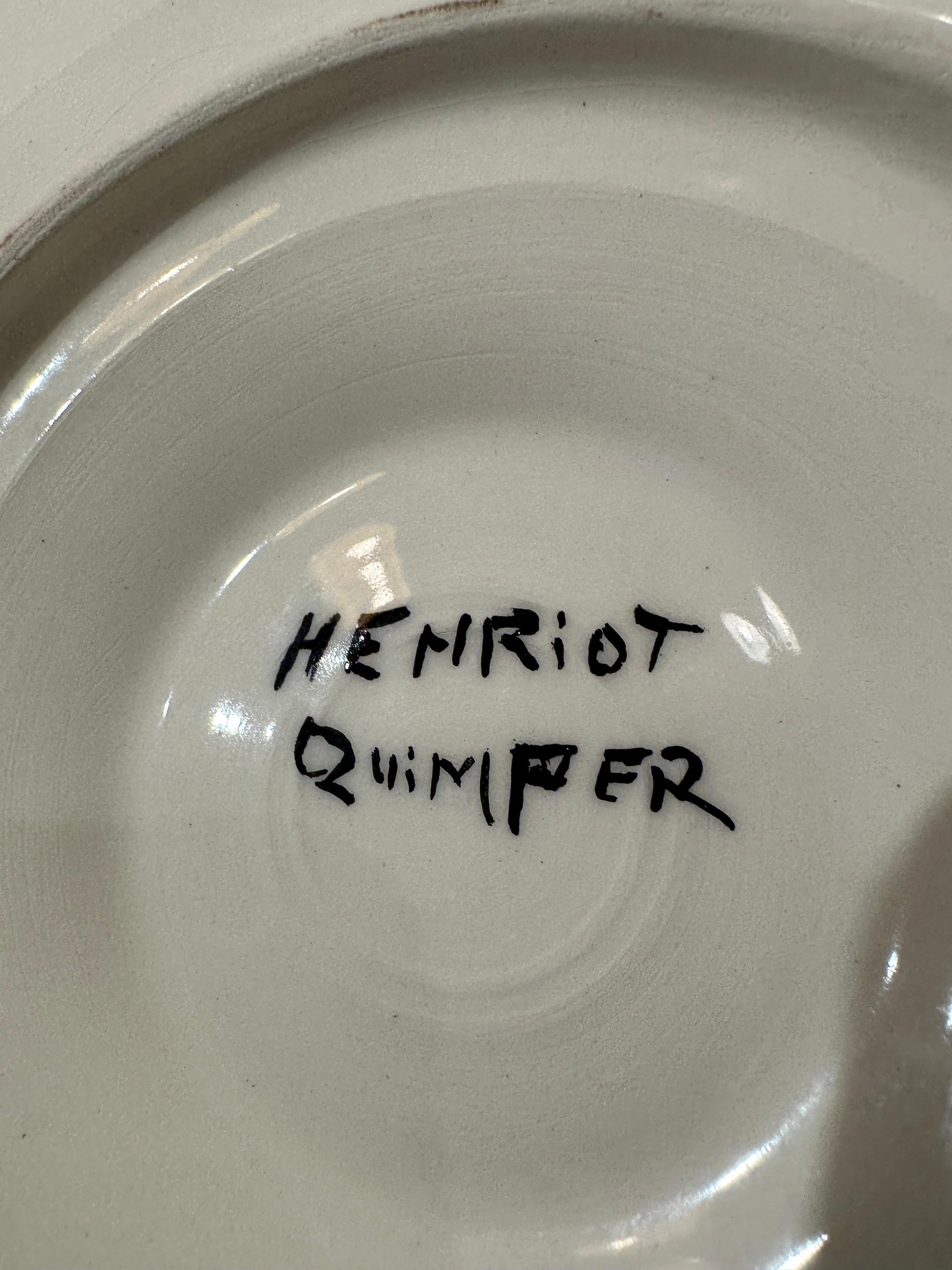 This RARE complete set of 13 (1 platter and 12 plates) Henriot Quimper black faience oyster plates is a stunning example of the beauty and craftsmanship of Quimper's original creations.  Each plate features a unique and intricate hand-painted design