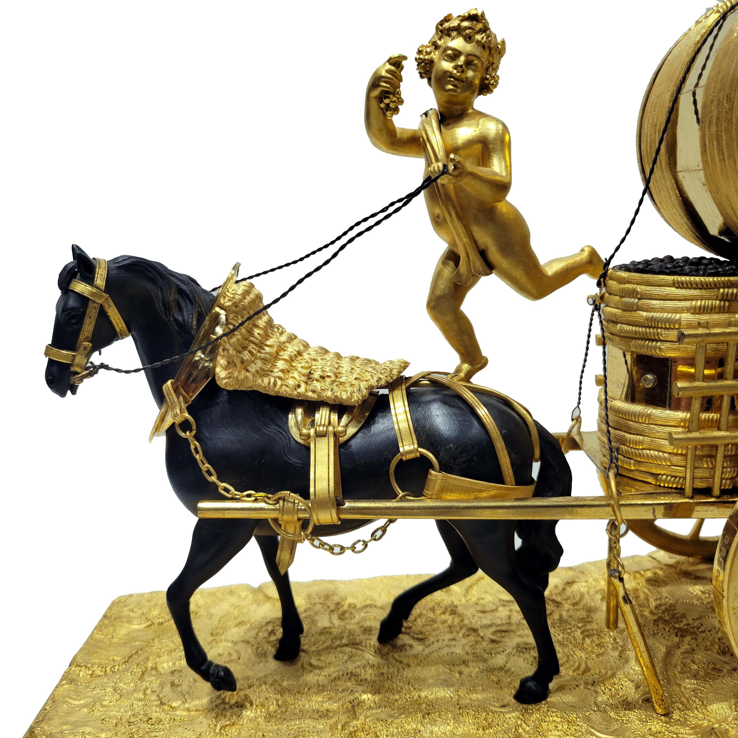 A very important and rare Directoire clock, French, circa 1790. Patinated and gilt bronze with exquisite details.
Depicting a horse driven carriage, carrying barrels of grapes and wine with a cherub as the driver.
Burnished fire-gilt highlights.
