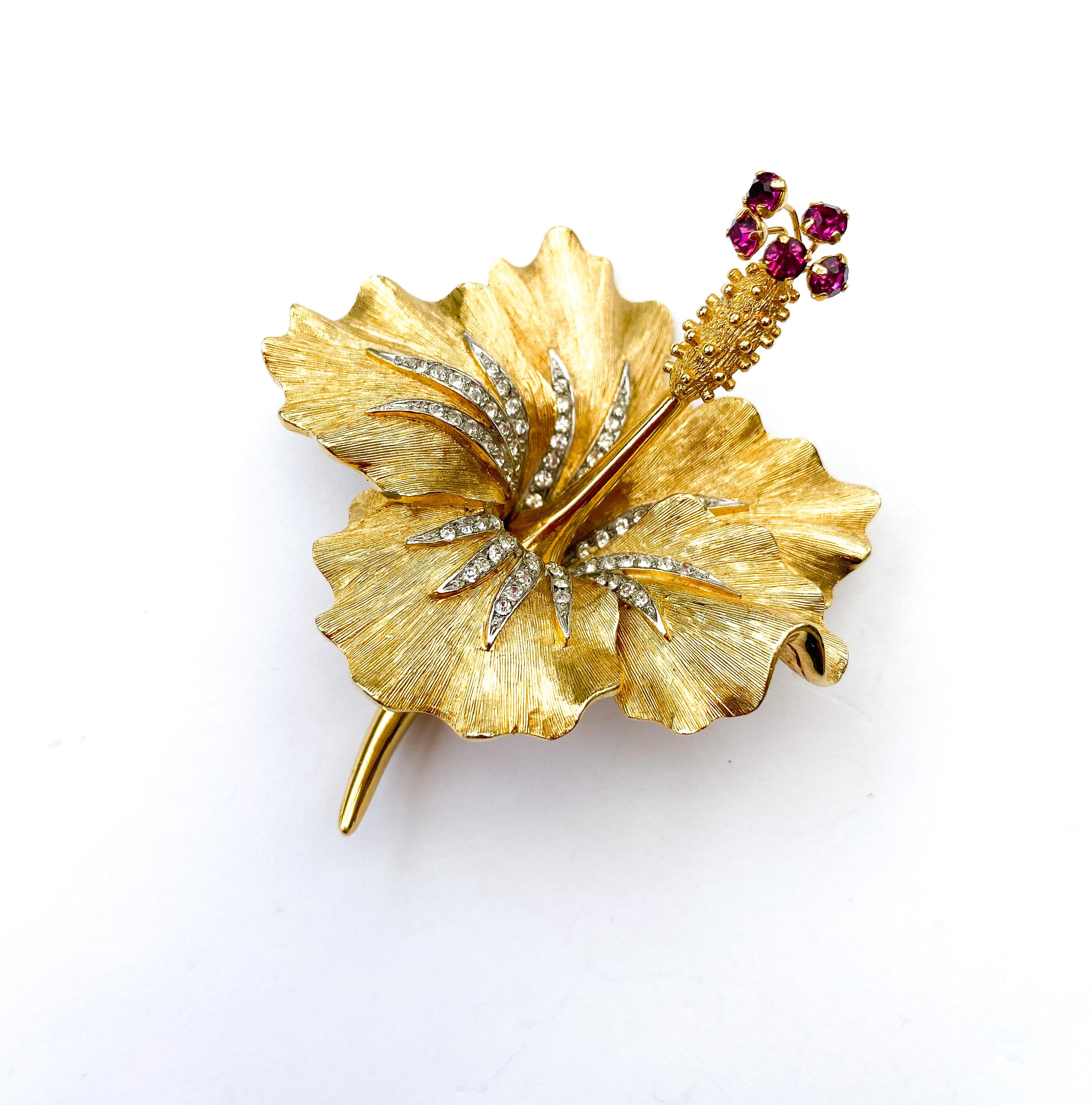 An exquisite and highly unusual 'hibiscus blossom' flower by Marcel Boucher, celebrated designer and maker of costume jewellery, of the highest quality and exceptional design. A very rare design from the 1960s, this brooch is made of gilded metal,