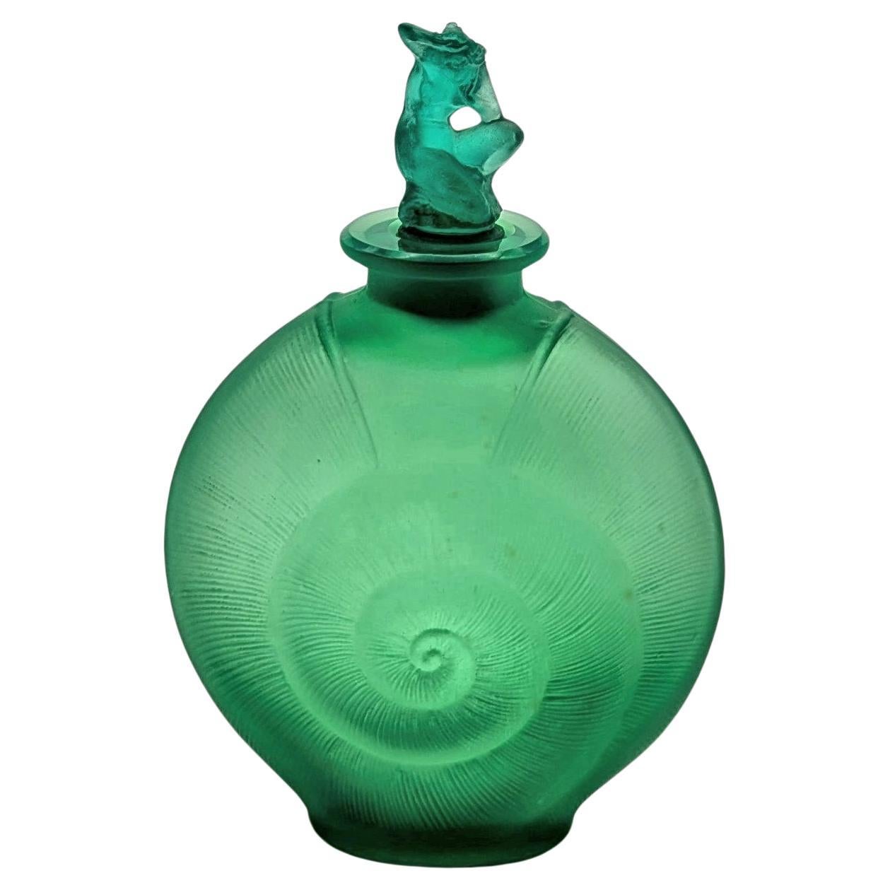 a rare green René Lalique glass perfume bottle "Amphitrite" from ca. 1920