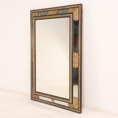 A Rare Large French Ebonized Wood and Brass Repousse Mirror, 19th C.