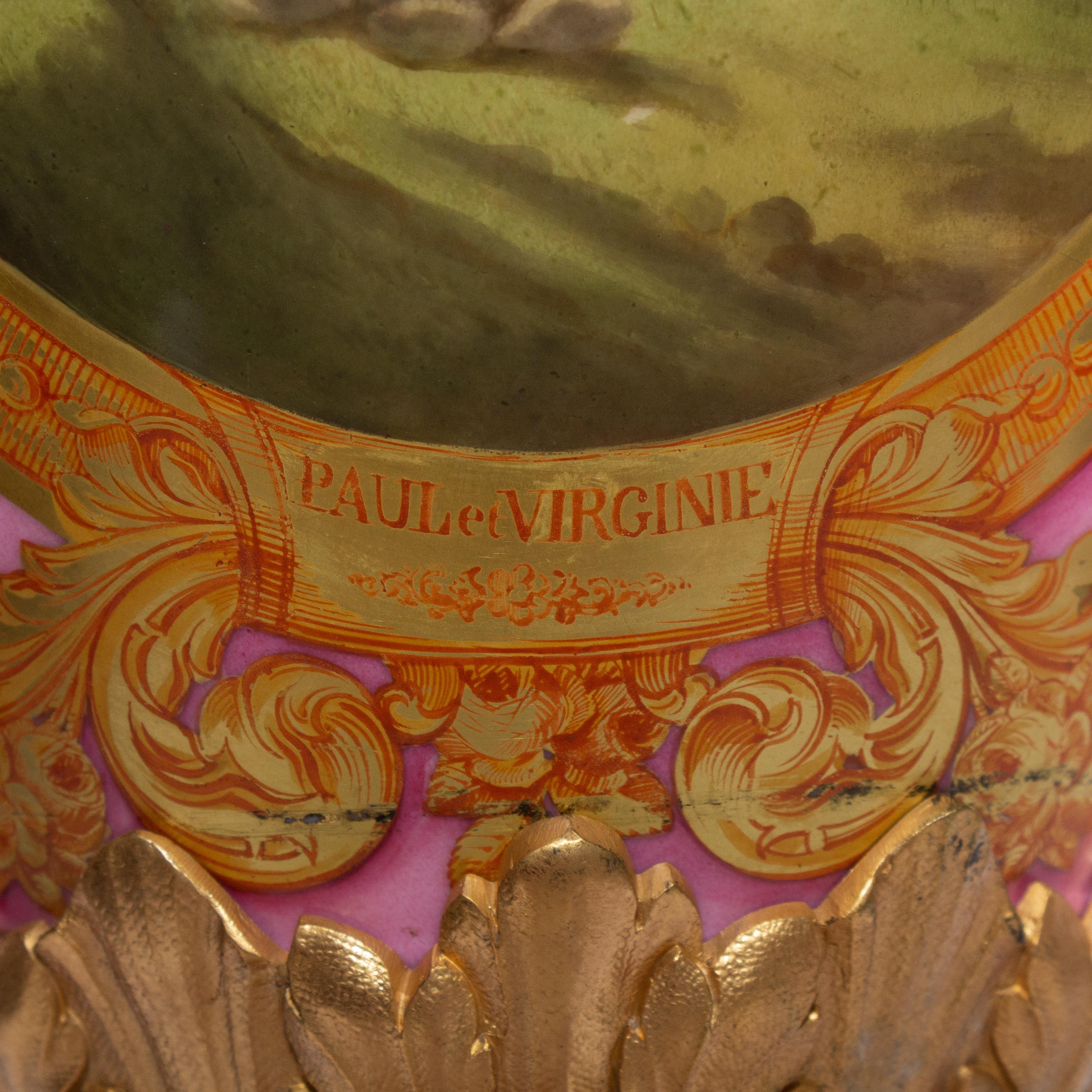 A magnificent Louis Philippe period Sevres ormolu mounted vase, circa 1847.
Handles are serpents holding an apple in their mouth, referring perhaps to Adam and Eve. A beautifully painted scene in the front depicts the story of Paul and Virginie
