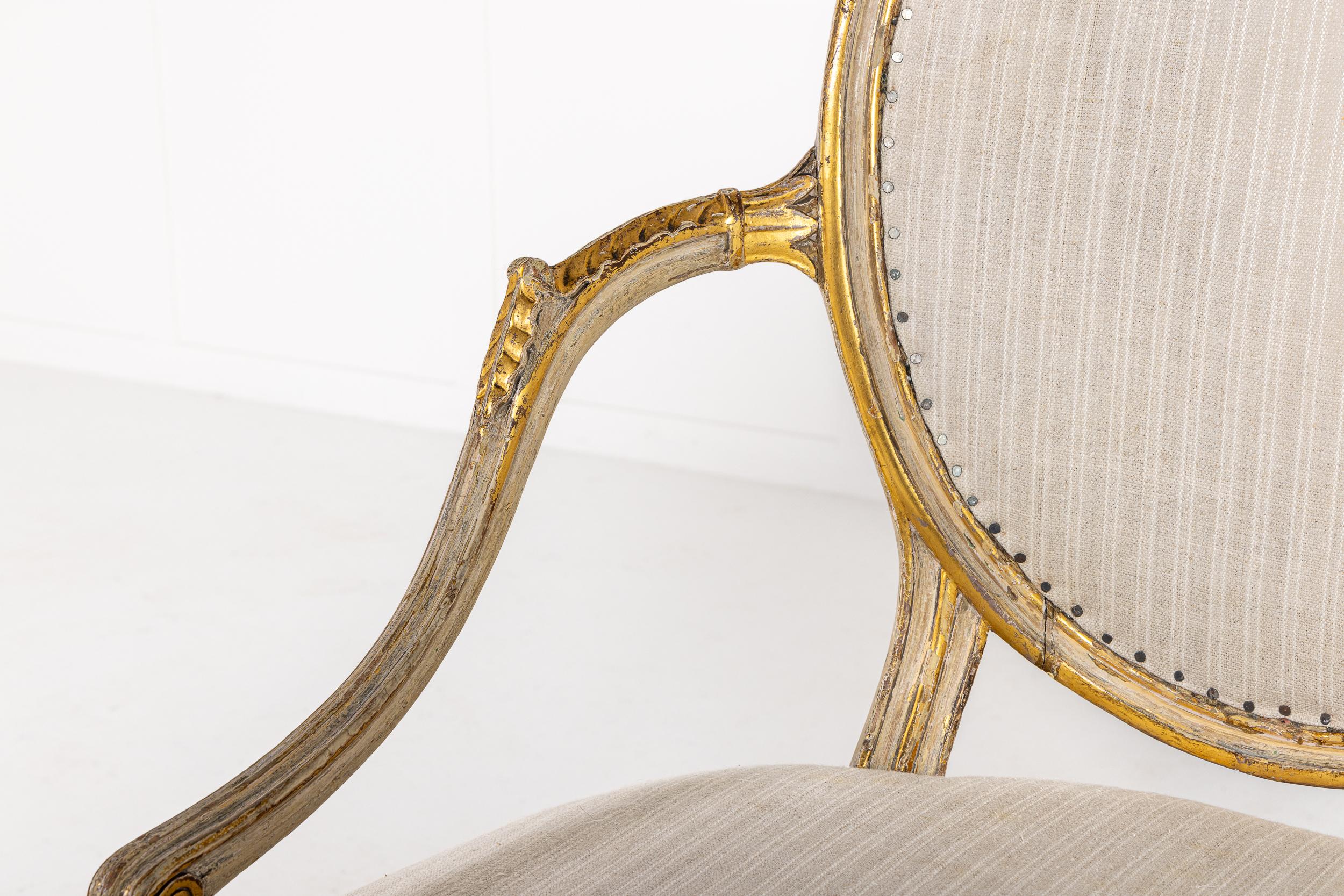 A Rare, Very Interesting Late 18th Century English Formal Armchair, Probably by John Linnell, in Paint and Parcel Gilding.

This lovely chair is a highly refined example of the salon or drawing room chair, influenced by French Louis XVI models, that