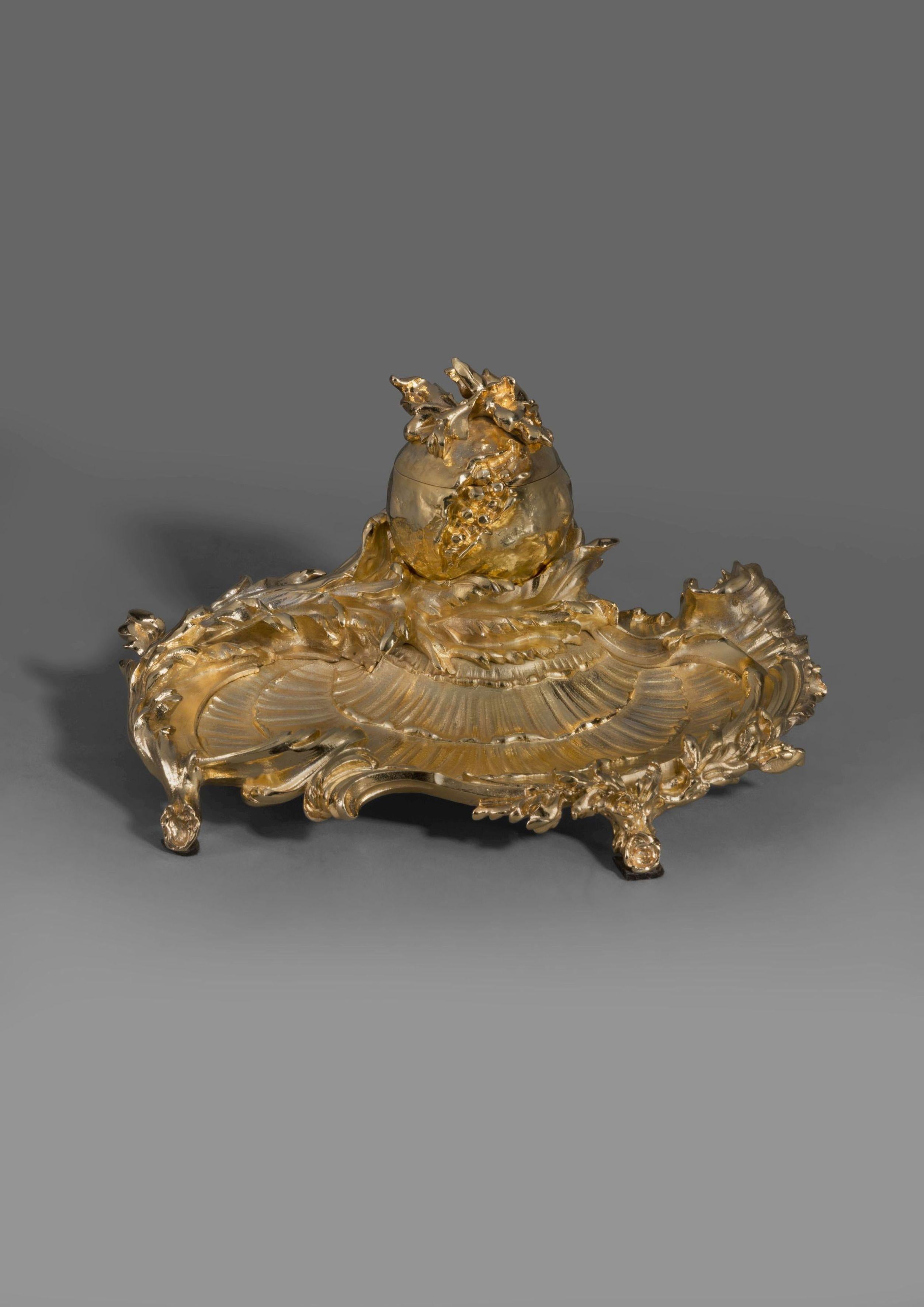 A Rare Louis XV Style gilt bronze Encrier, By Paul Sormani. 

French, circa 1870. 

Signed 'P. Sormani, Paris' to the underside of the cover. 

This finely cast and chased gilt bronze encrier is of rocaille form with scrolling leaves and branches