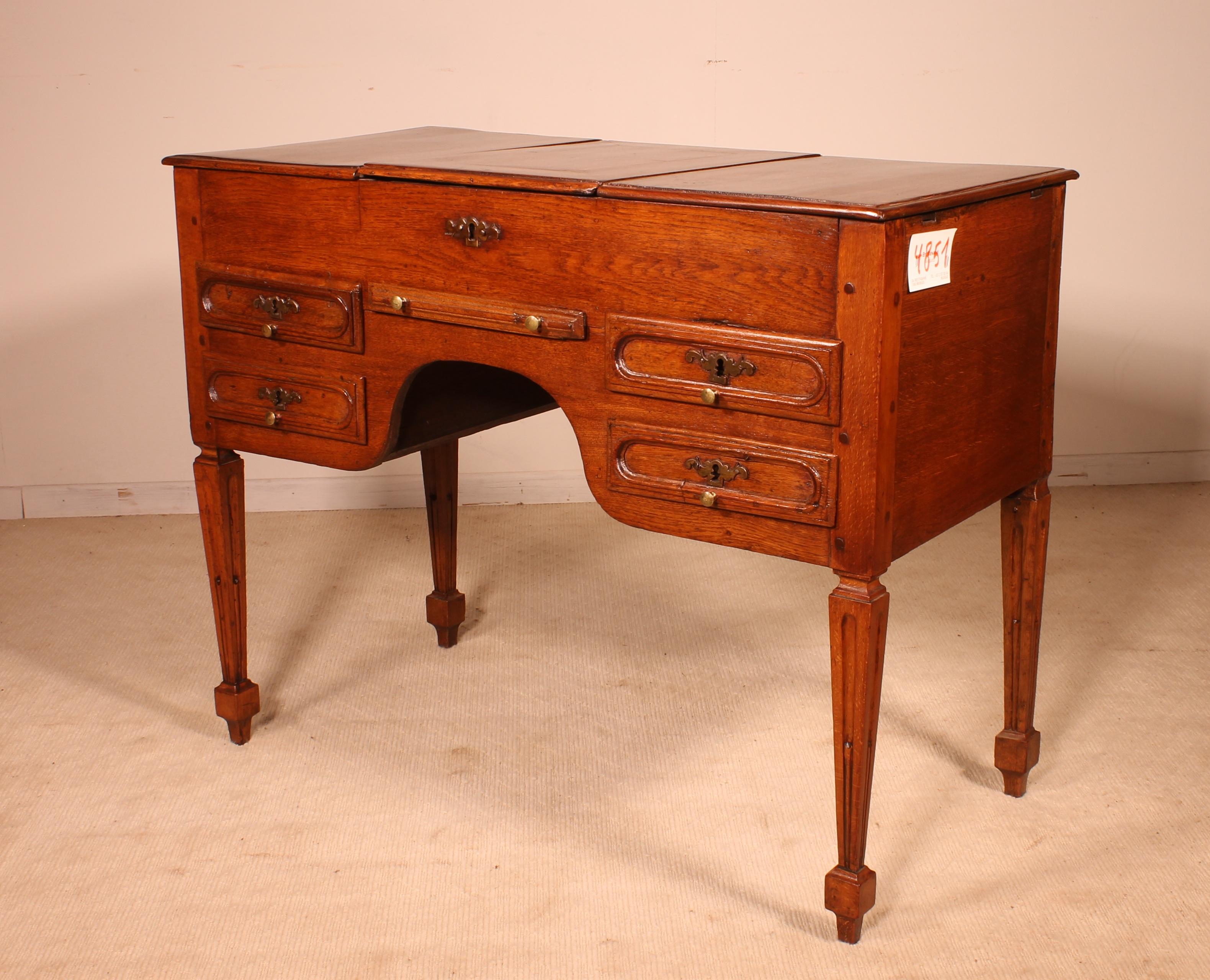 A rare antique Louis XVI oak dressing table,
Lovely piece in very good condition. The top flaps open to reveal 3 sections. On the lower section of the piece, we can find four small shaped drawers with original turned knobs.
Lovely carved Louis XVI