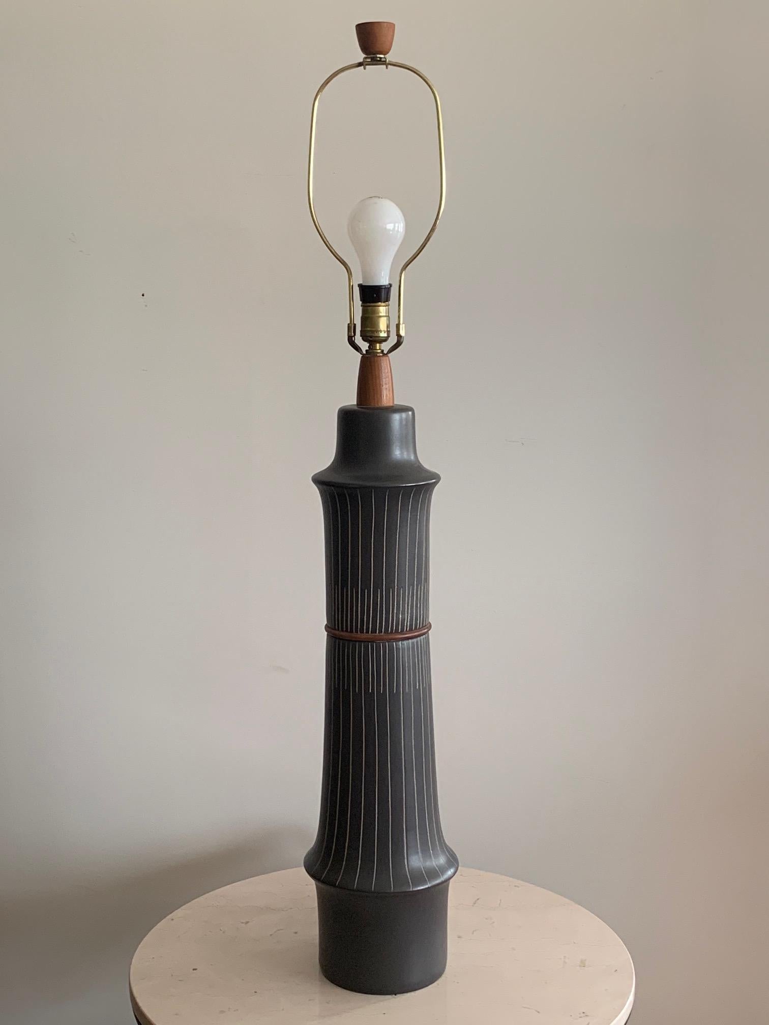 A stunning Martz lamp made of two sections with elegant sgraffito decoration. Measures: Ceramic base is 26.75