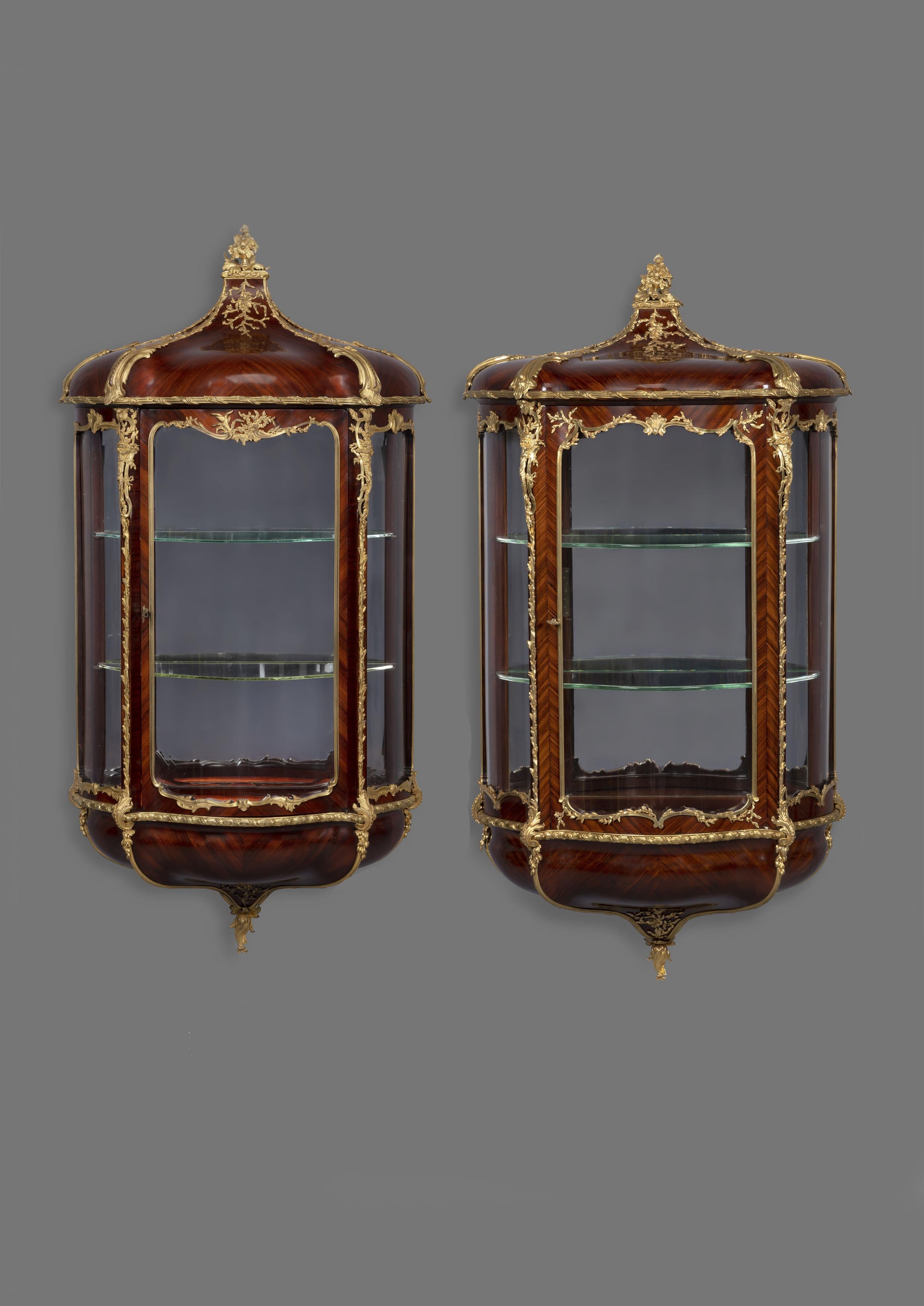 A rare and unusual matched pair of Louis XVI style gilt bronze-mounted wall vitrines by Joseph-Emmanuel Zwiener. 

French, circa 1890.

Signed ‘E. Zwiener’ to the base of the bronze mount to one door. The reverse of the bronze mounts stamped