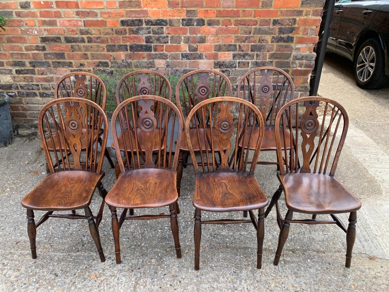 Wood Rare Matched Set of Sixteen 19th Century Windsor Draught Back Chairs