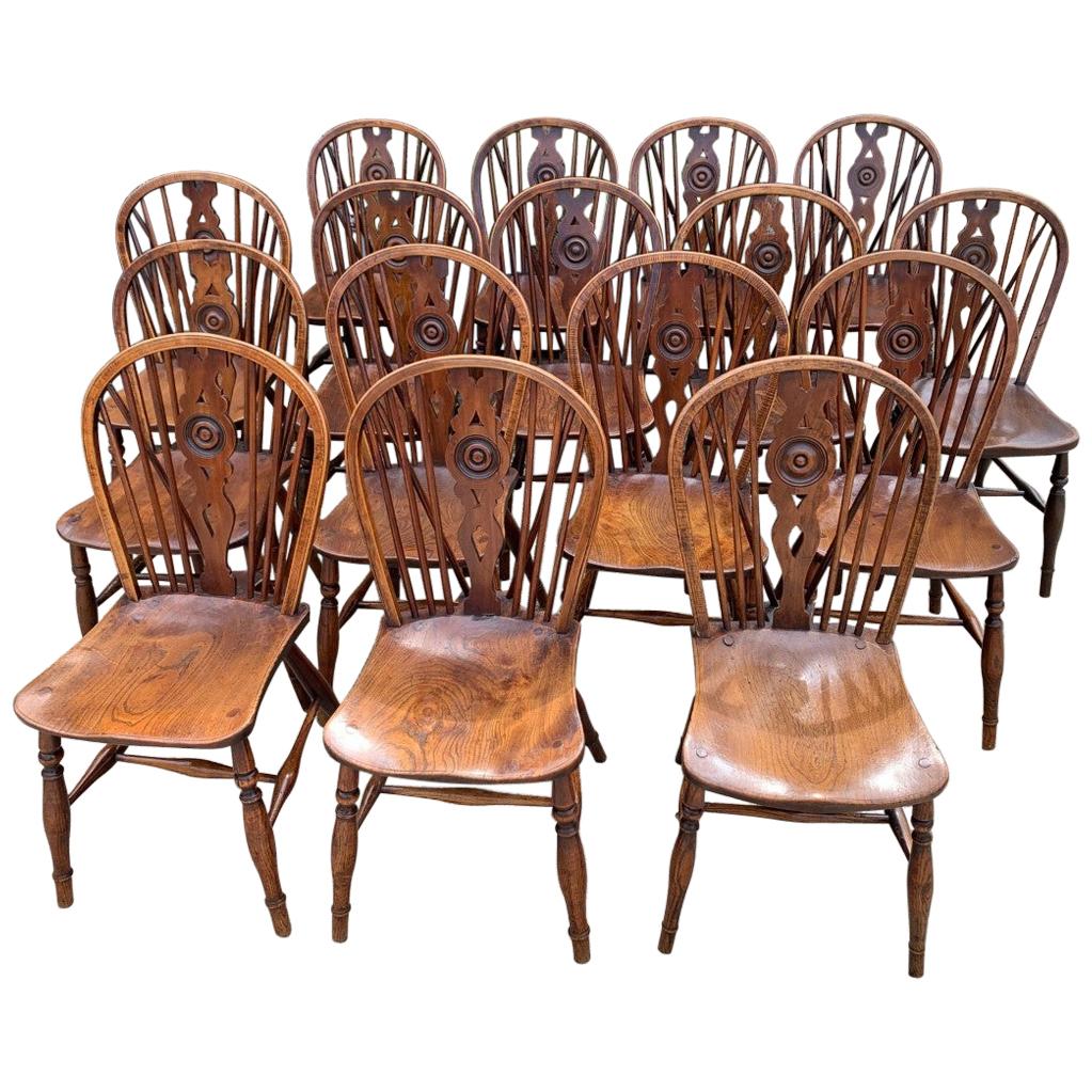 Rare Matched Set of Sixteen 19th Century Windsor Draught Back Chairs