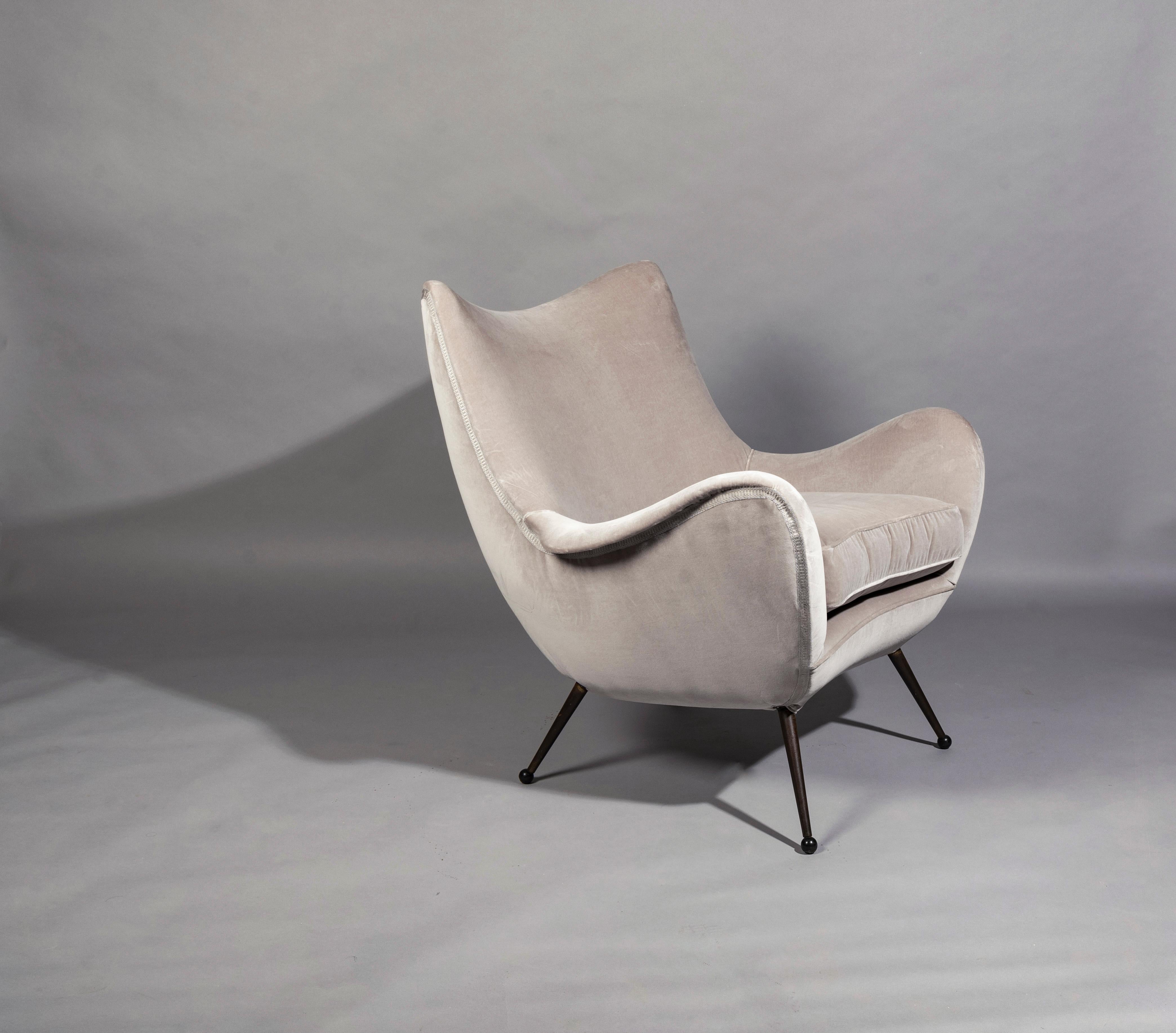 A very rare of sophisticated and dynamic shaped lounge chairs by Melchiorre Bega, brass feet reupholstered in Lelievre grey cotton velvet.
