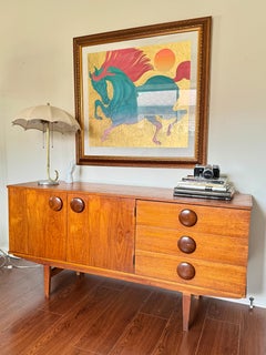 A rare mid century modern sideboard with round wooden pulls, circa 1960s