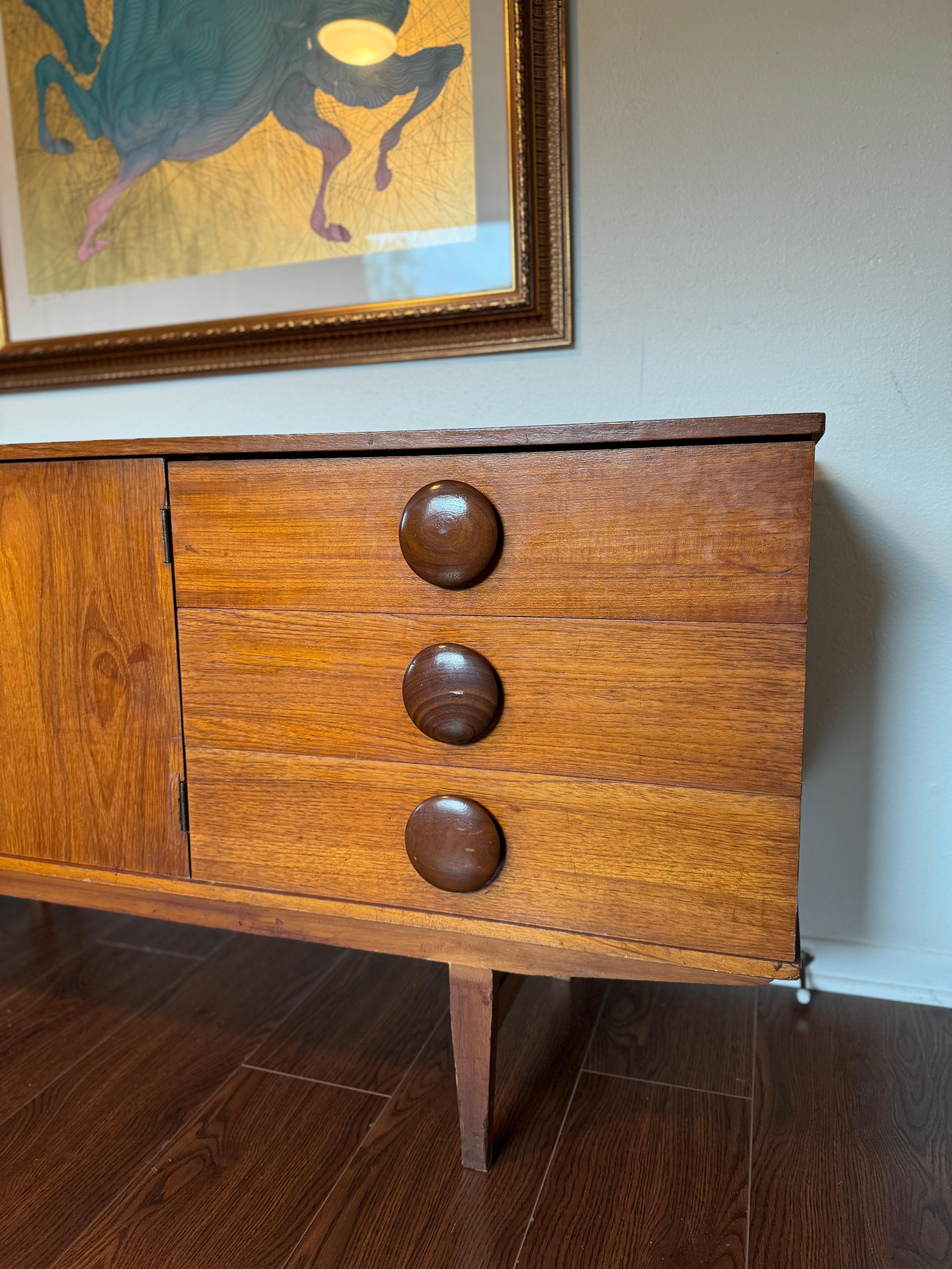Teak A rare mid century modern sideboard with round wooden pulls, circa 1960s For Sale