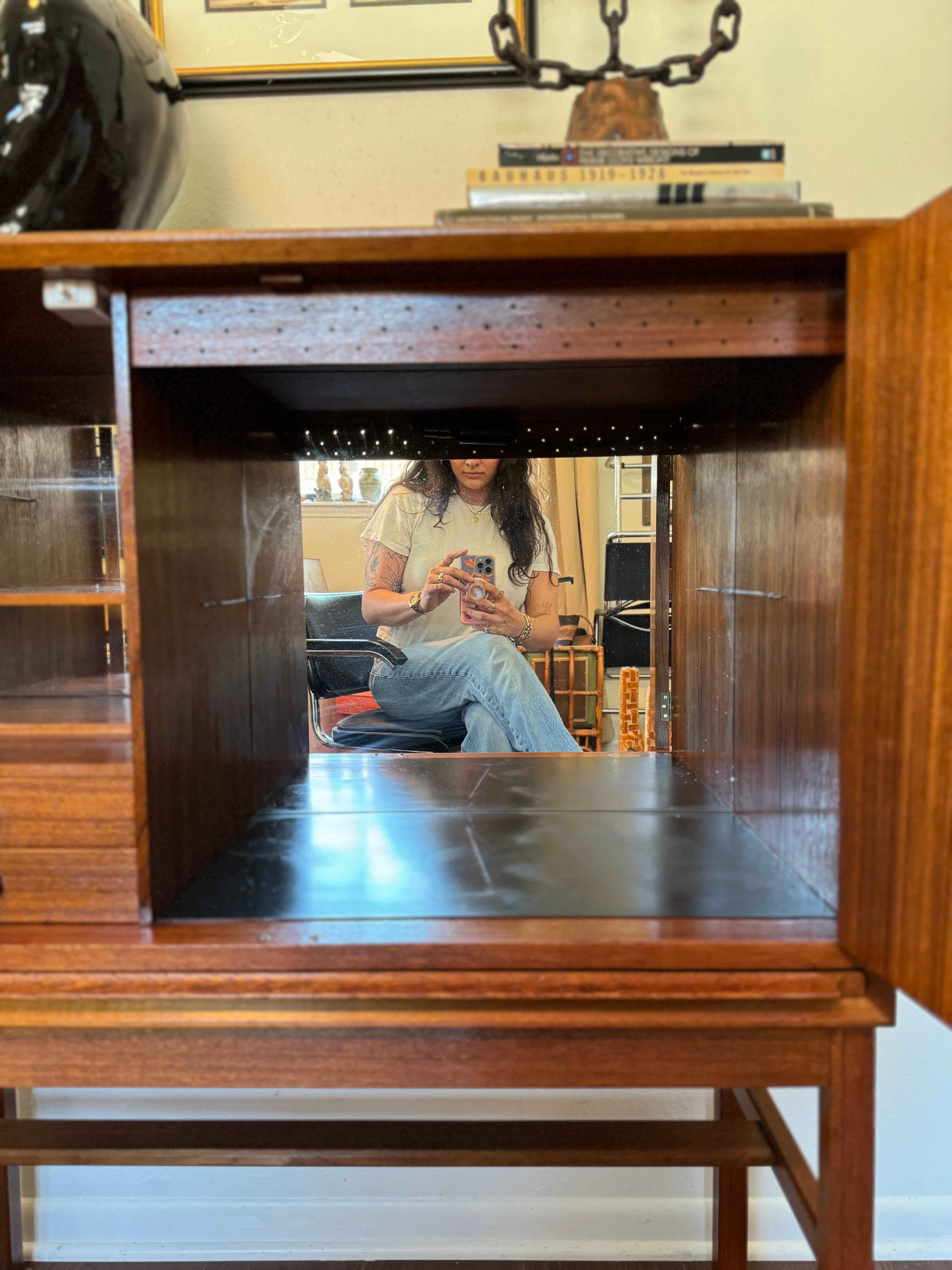 A rare mid century modern tall bar cabinet with a pull out surface 3
