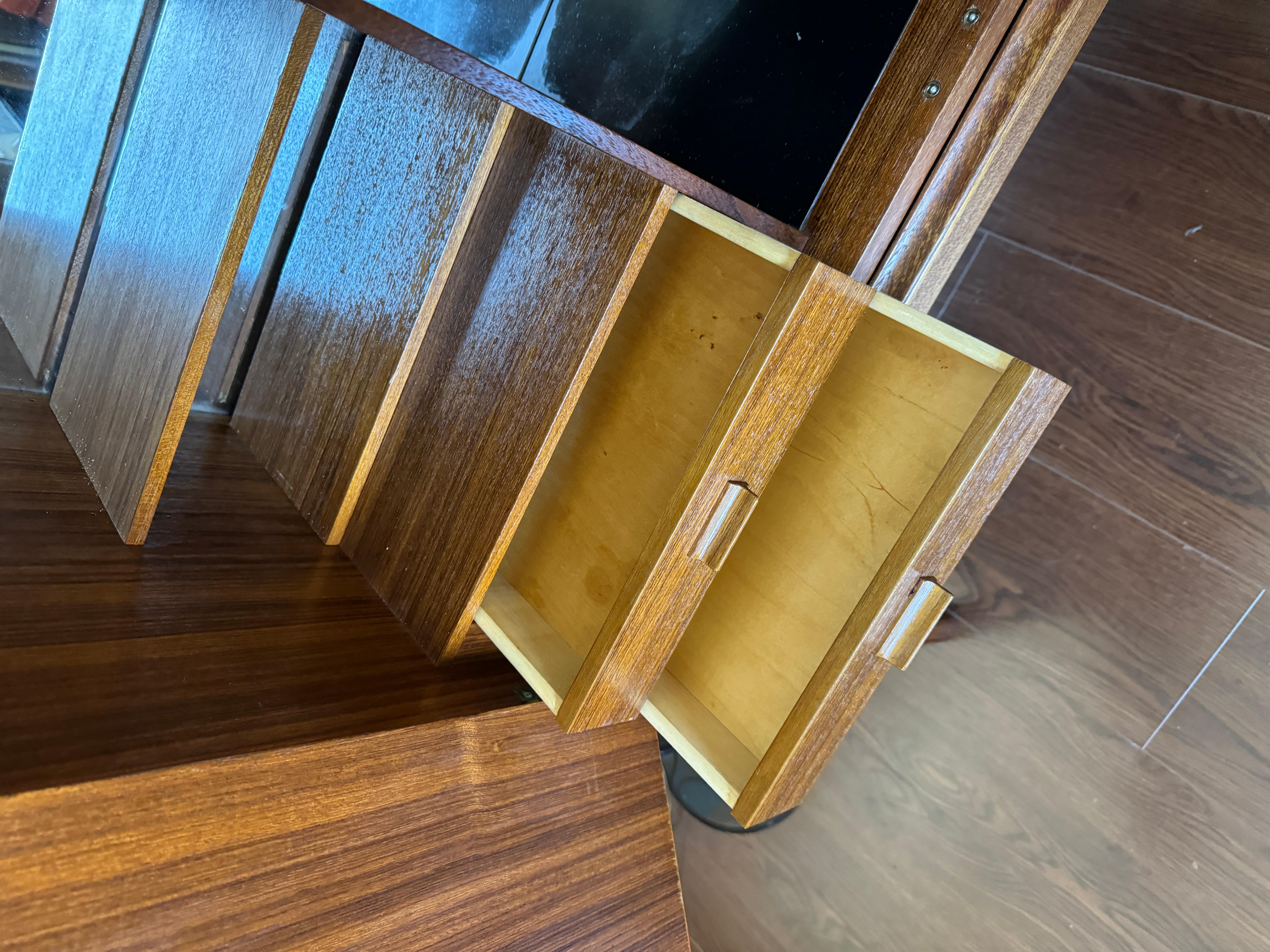 Mid-Century Modern A rare mid century modern tall bar cabinet with a pull out surface