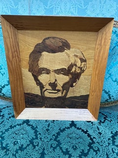 A rare mid-century portrait of Abraham Lincoln executed in inlaid woods signed K