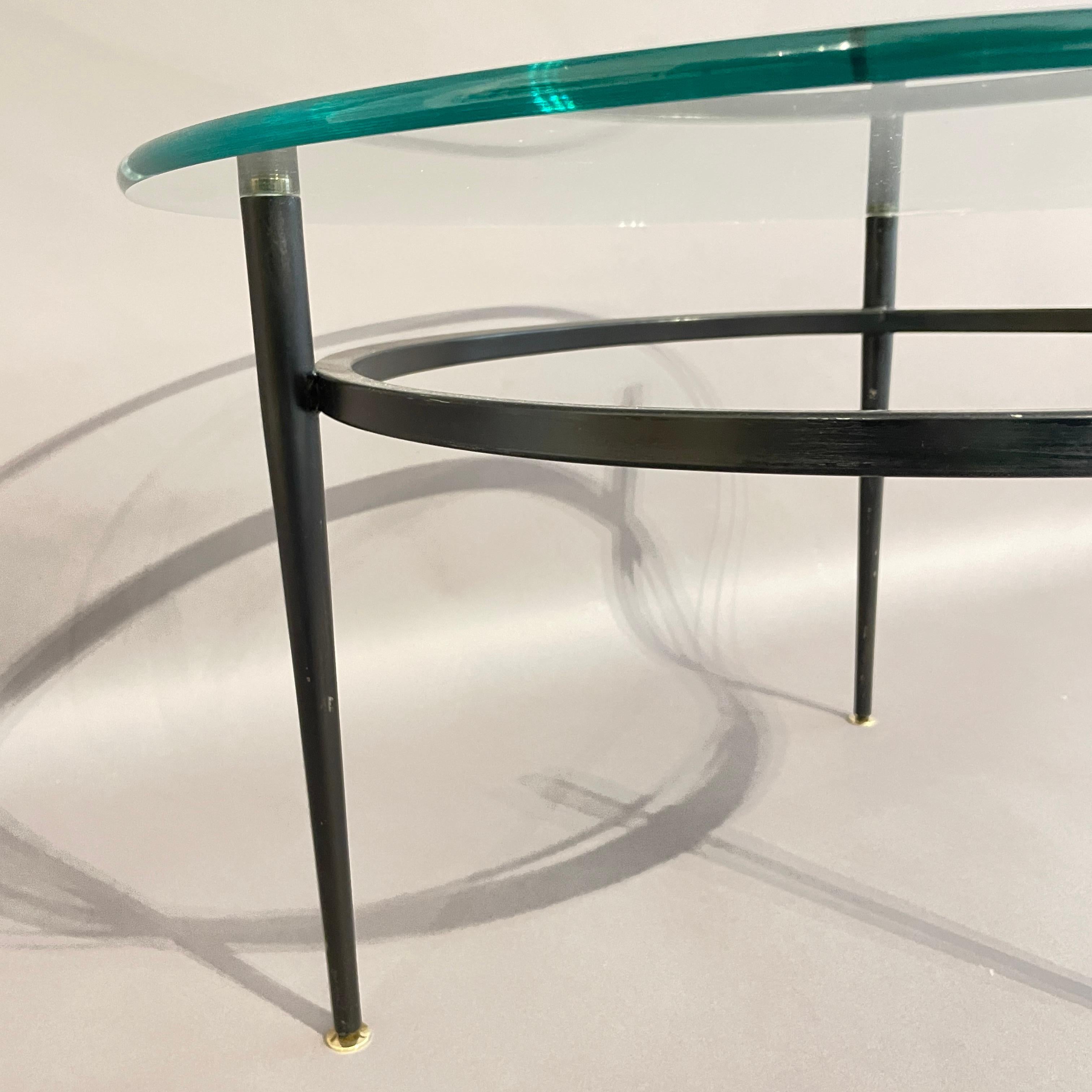 Welded A rare minimalist tubular Roger Le Bihan circular coffee table with brass feet