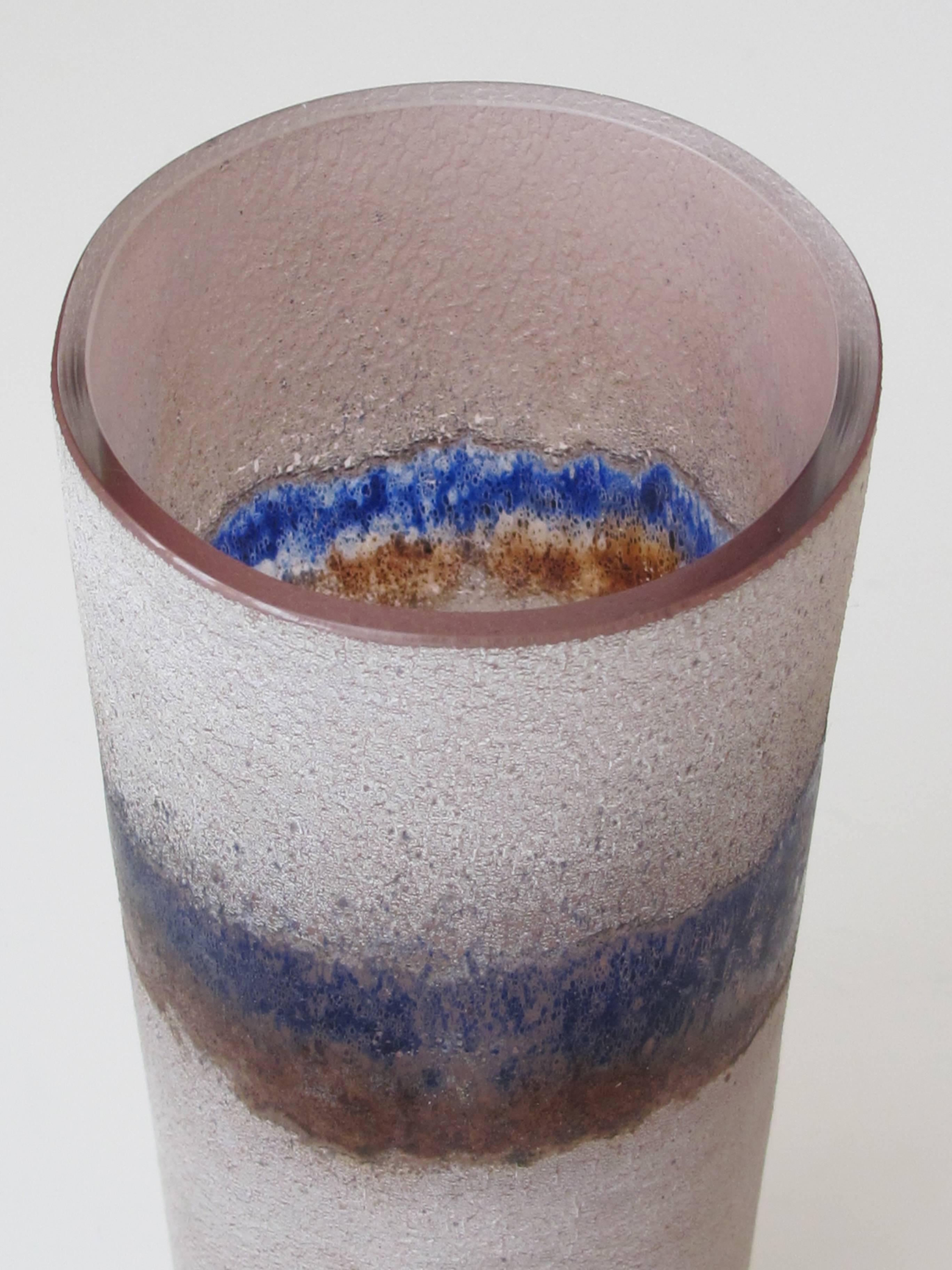 A rare and large-scaled Murano 1960s Alfredo Barbini 'scavo' glass cylindrical vase; etched signature 'Barbini Murano' on underside; the tall vase with acid etched 'scavo' surface in hues of amethyst and cobalt blue.