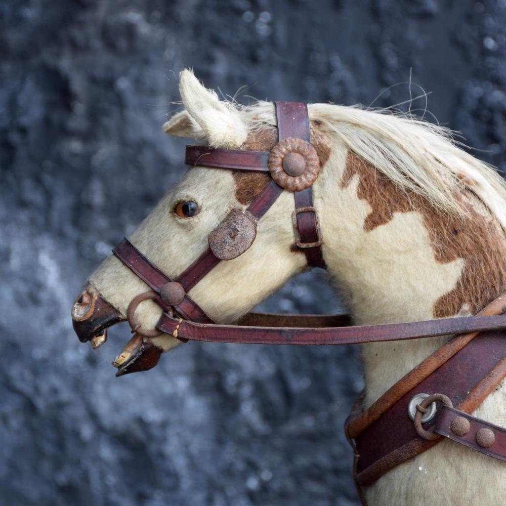 A Rare Museum 19th Century Horse and Wicker Childs Push Along Carriage 
We are proud to offer a very rare museum quality example of a 19th Century Horse and Wicker Childs Push Along Carriage. A carved wooden horse in a very rare trotting position