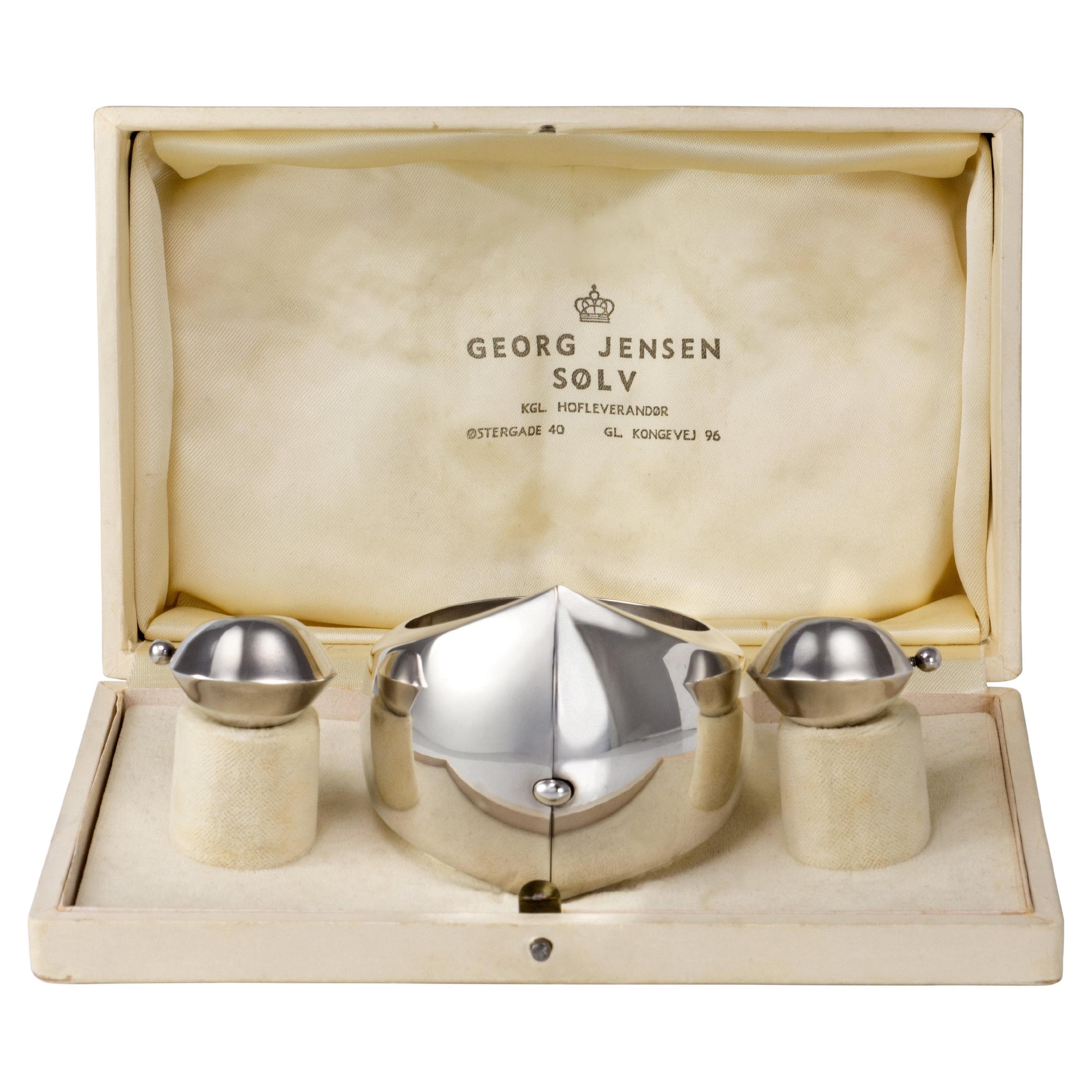A collector's set. A rare and famous design by Nanna and Jørgen Ditzel for Georg Jensen, of. a cuff and earring set, Denmark, c. 1960. Earrings are stamped Georg Jensen, Sterling, Denmark, 126. Bracelet is stamped Georg Jensen, Sterling, Denmark,