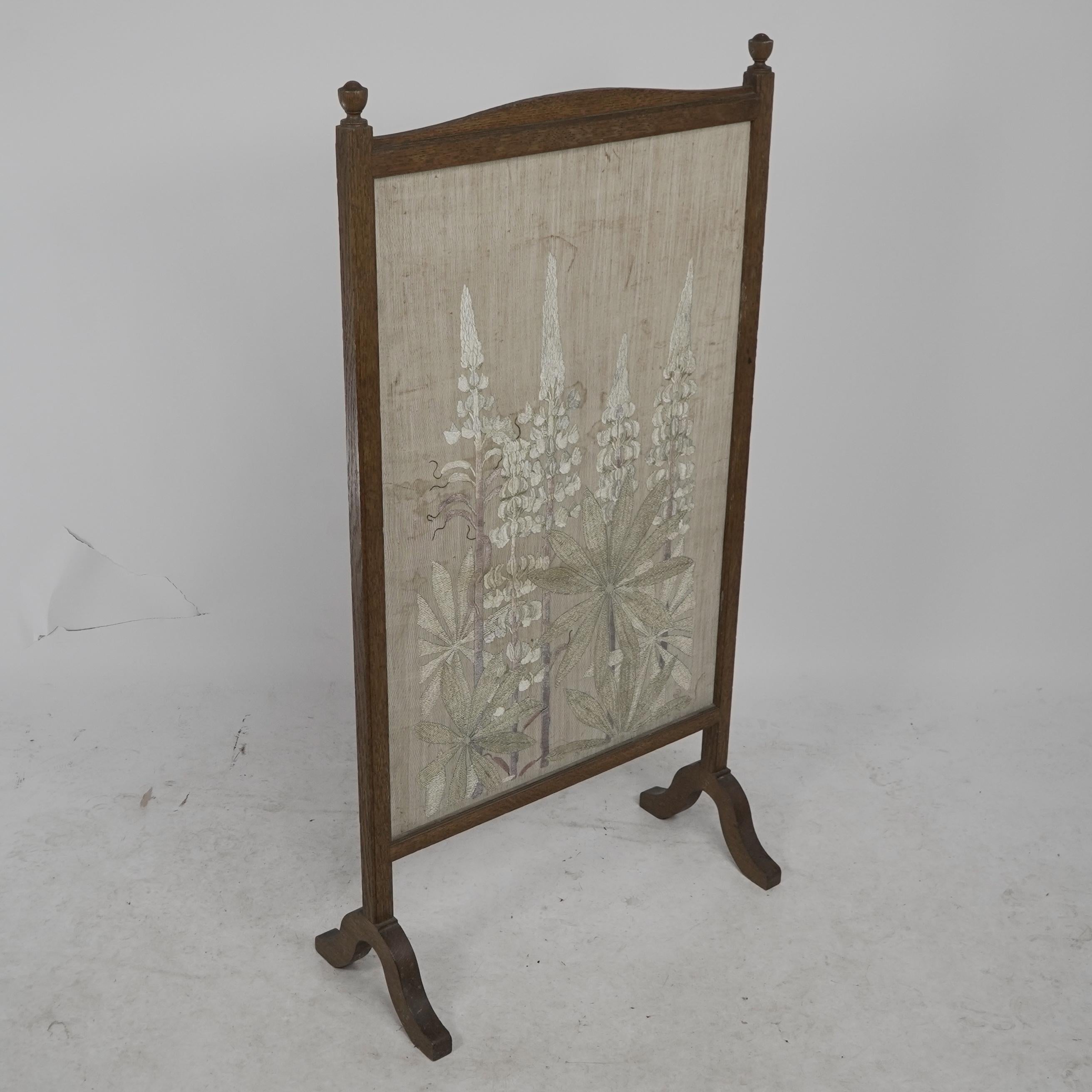 Selwyn Image for the Century Guild. A rare Arts and Crafts oak and floral embroidery fire screen decorated with stylized foxgloves. 
Needlework signature CG to the lower right-hand corner.
