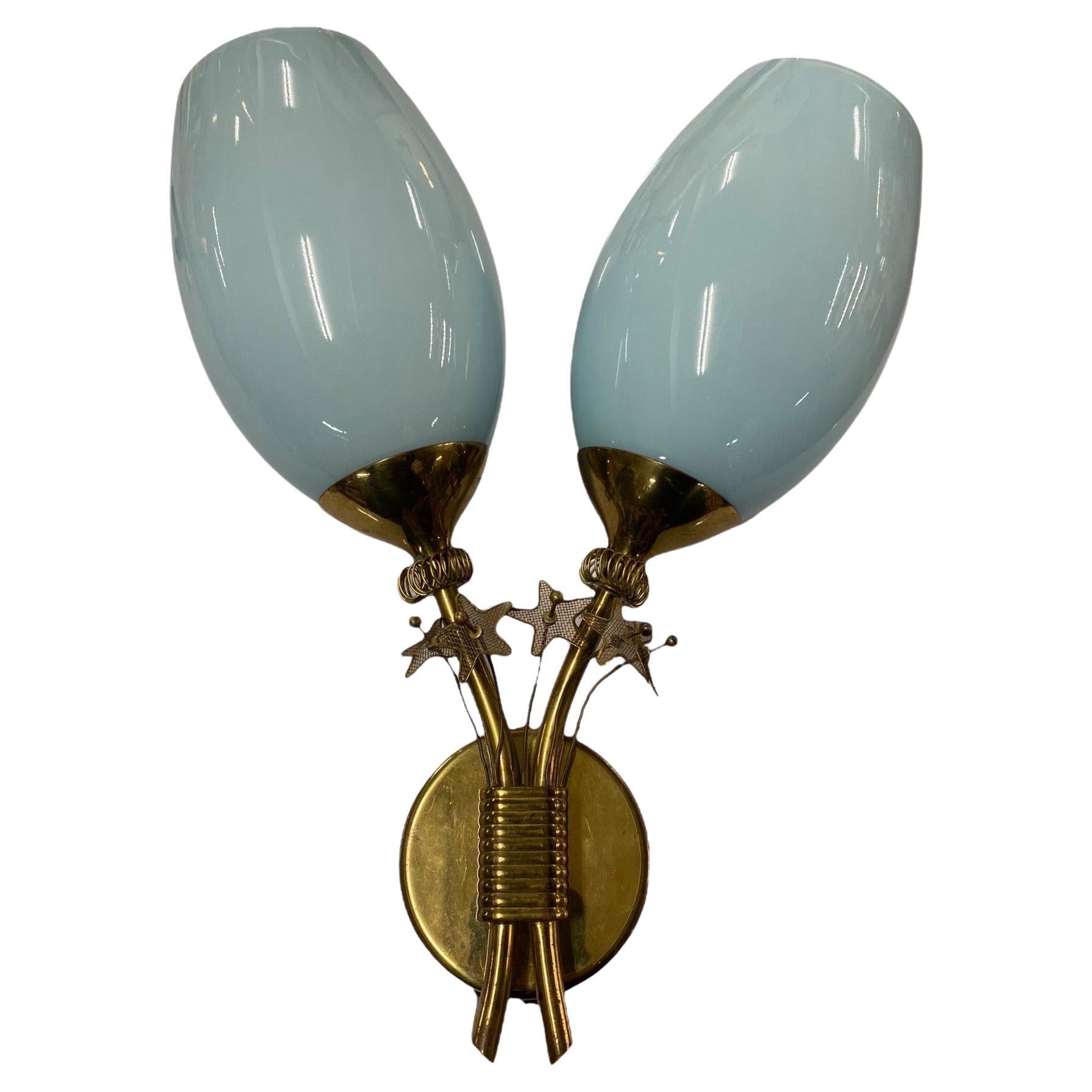 An extremely rare and brilliant wall lamp/sconce by Paavo Tynell, manufactured by Taito Oy in Finland in the 1950s. These kinds of wall lamps are highly sought after by collectors as well as end users world wide. The design is simple, pragmatic and