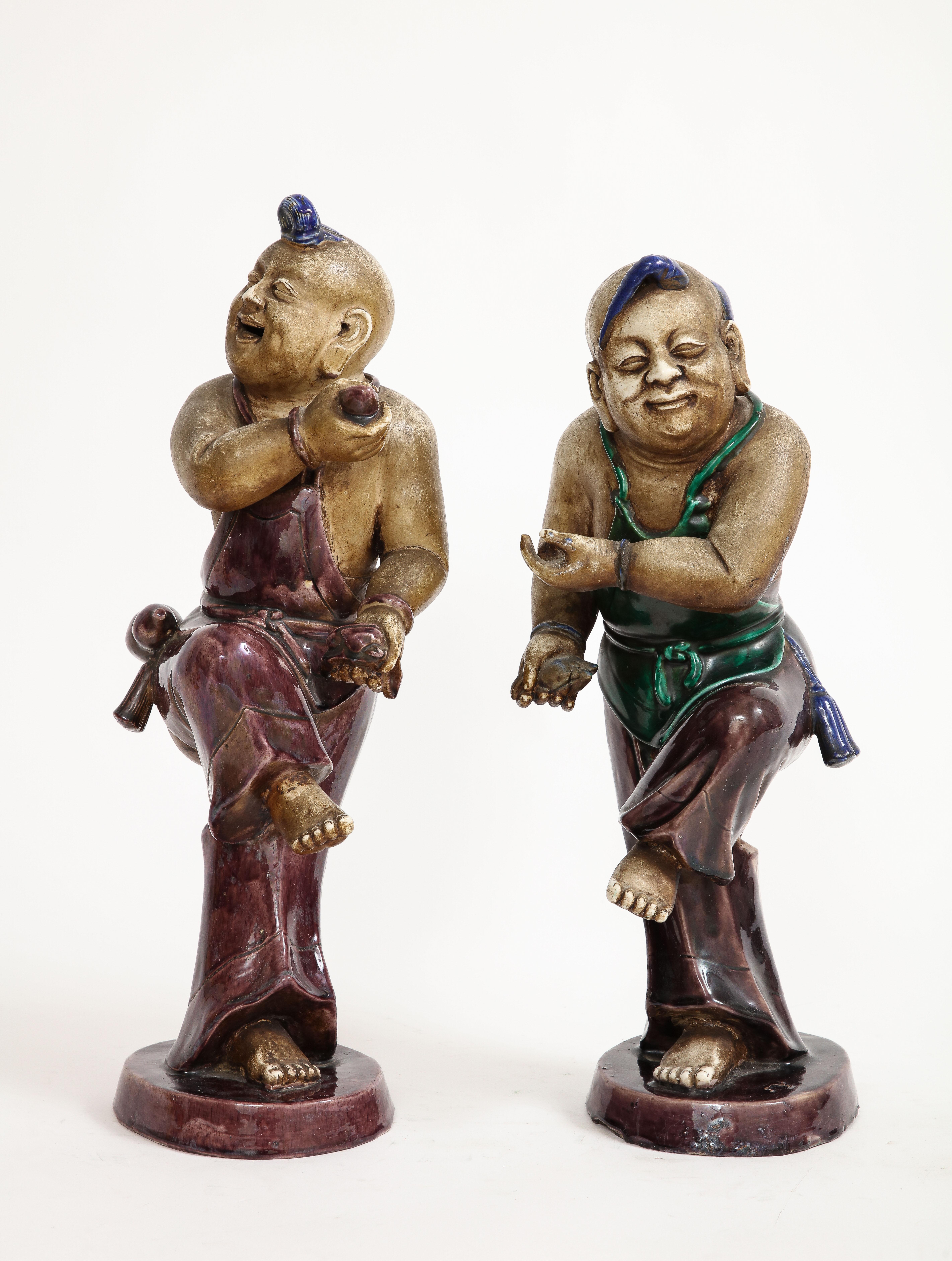 Chinese Export A Rare Pair Chinese Kangxi Biscuit Porcelain Figures of Boy w/ Enamel Decoration For Sale