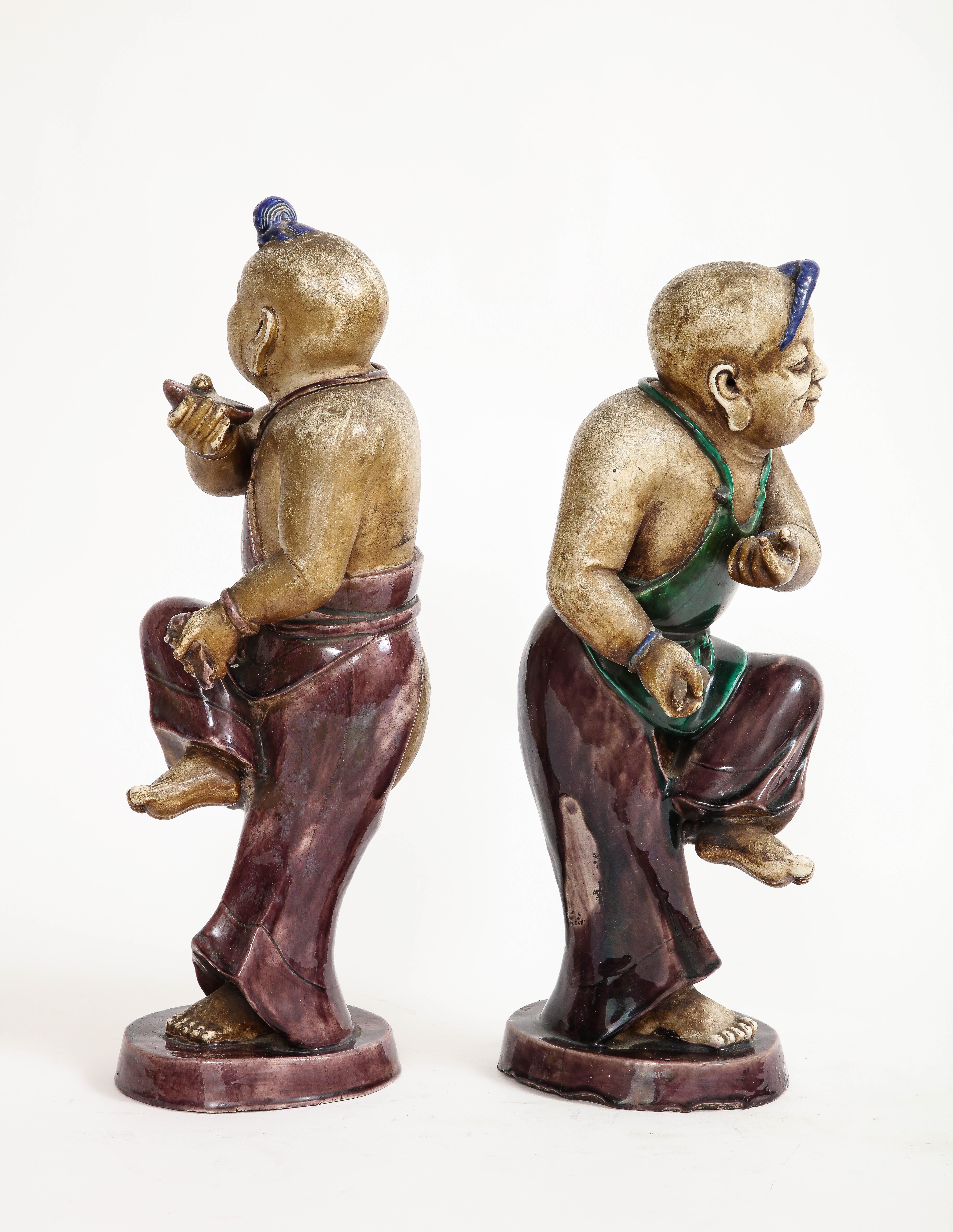 A Rare Pair Chinese Kangxi Biscuit Porcelain Figures of Boy w/ Enamel Decoration In Good Condition For Sale In New York, NY