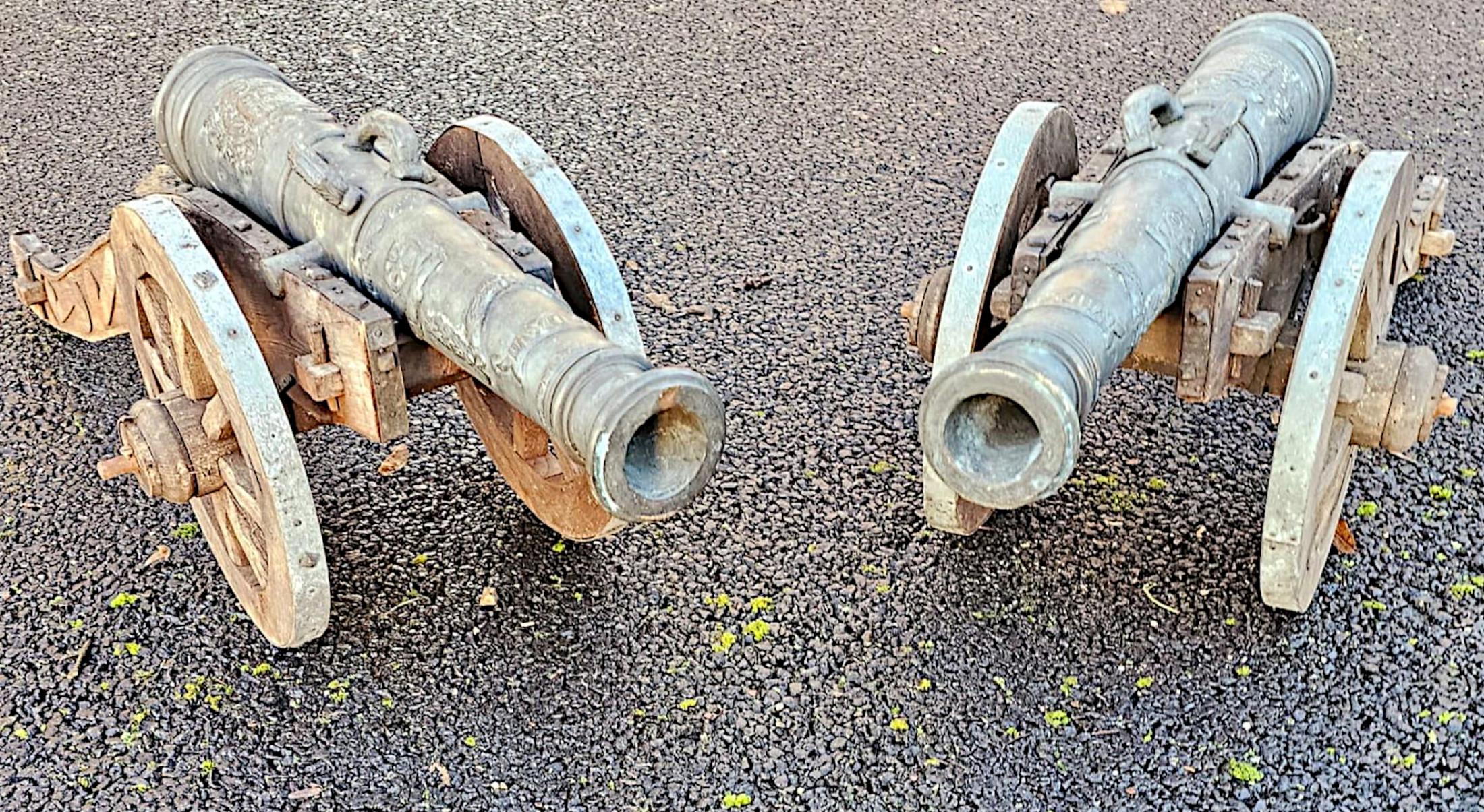 A very rare pair of 19th Century finely cast bronze barrelled signal cannons of exceptional quality with fabulous detail and rich patination.  This very fine pair of cannons have flared muzzles, tapering barrels with the top of each breech