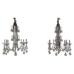 A rare pair of art deco chandeliers. 8 lights.
