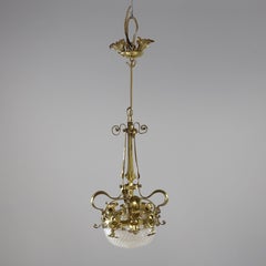 A rare pair of Arts and Crafts hand-hammered ceiling lamps