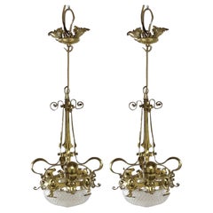 A rare pair of Arts and Crafts hand-hammered ceiling lamps