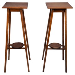 Antique A rare pair of Arts & Crafts Oak plant stands with square tops and tapering legs