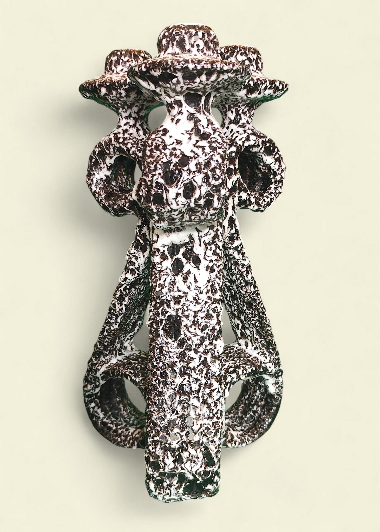 Una rara coppia di candelabri in 