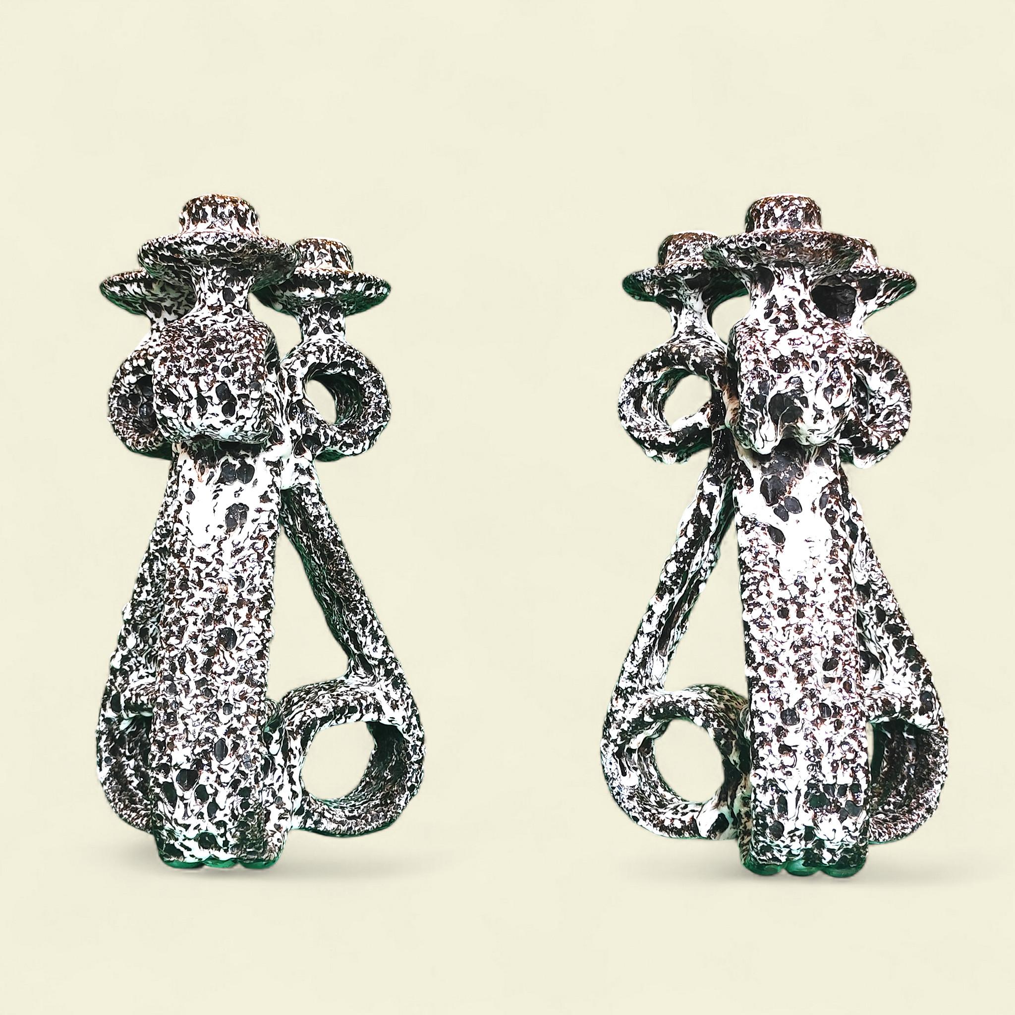 This pair of 37 cm high three-light candelabras features scrolls at the top and base of the shaft, constructed directly as a base in a 