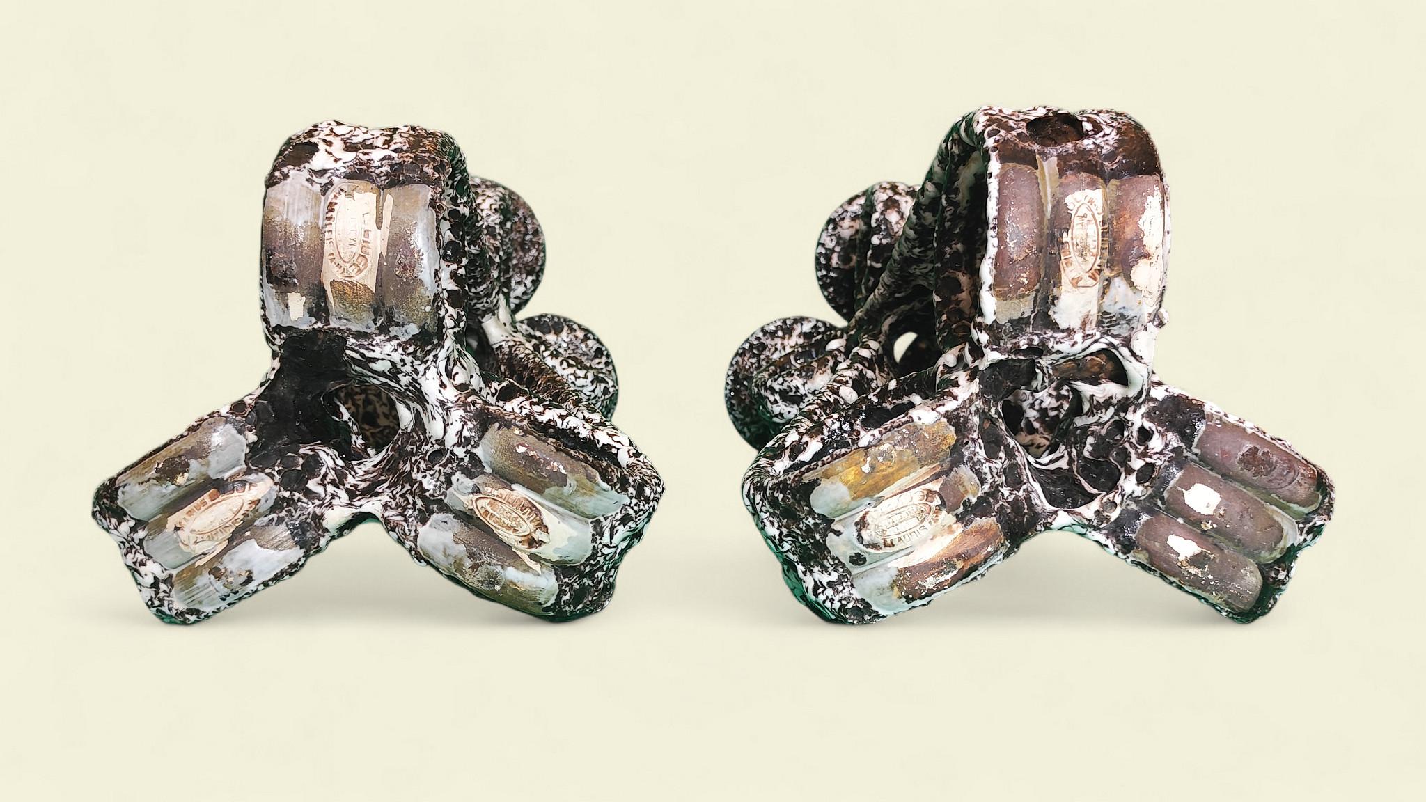 Smalto Una rara coppia di candelabri in 