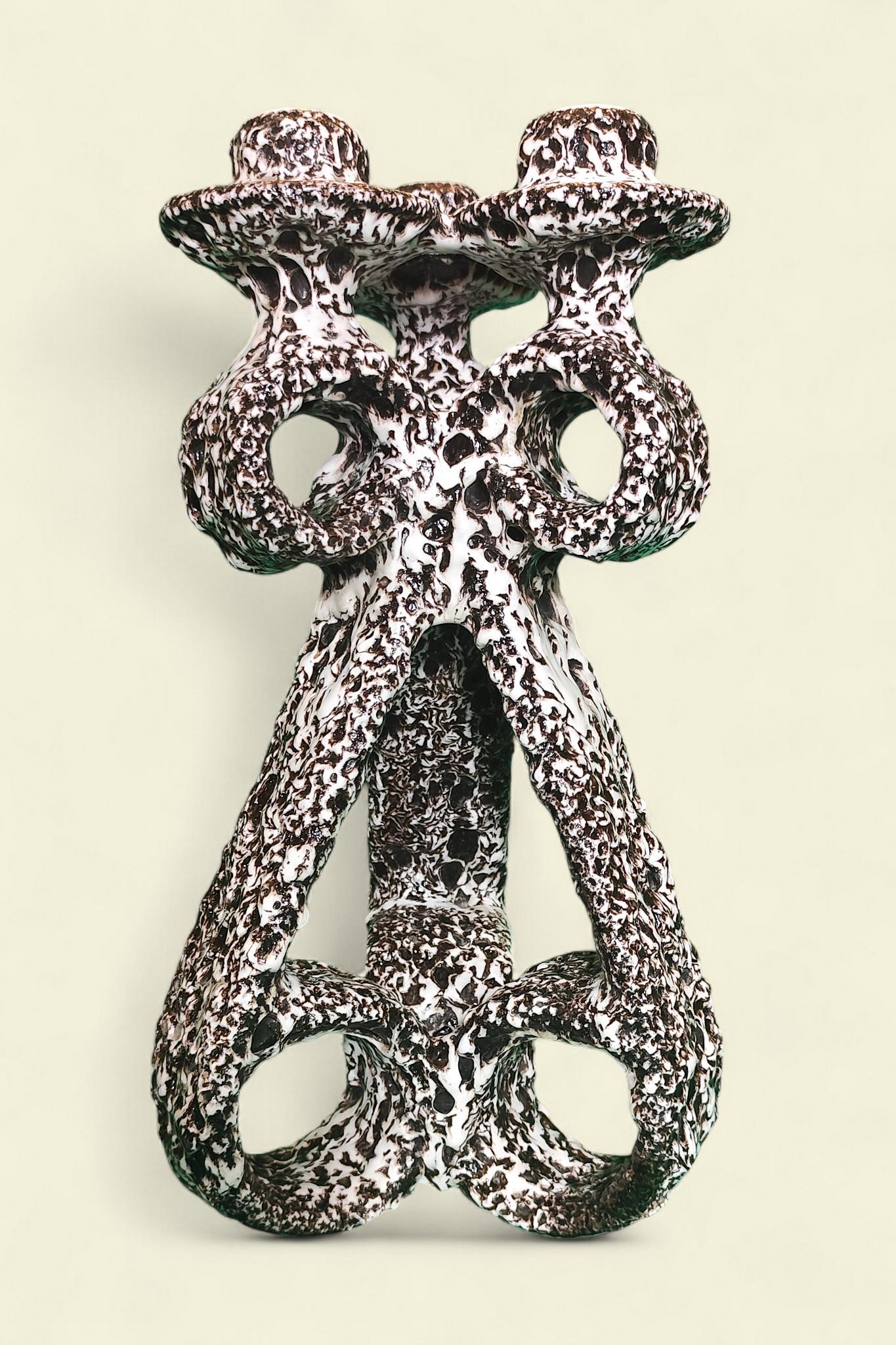 Una rara coppia di candelabri in 