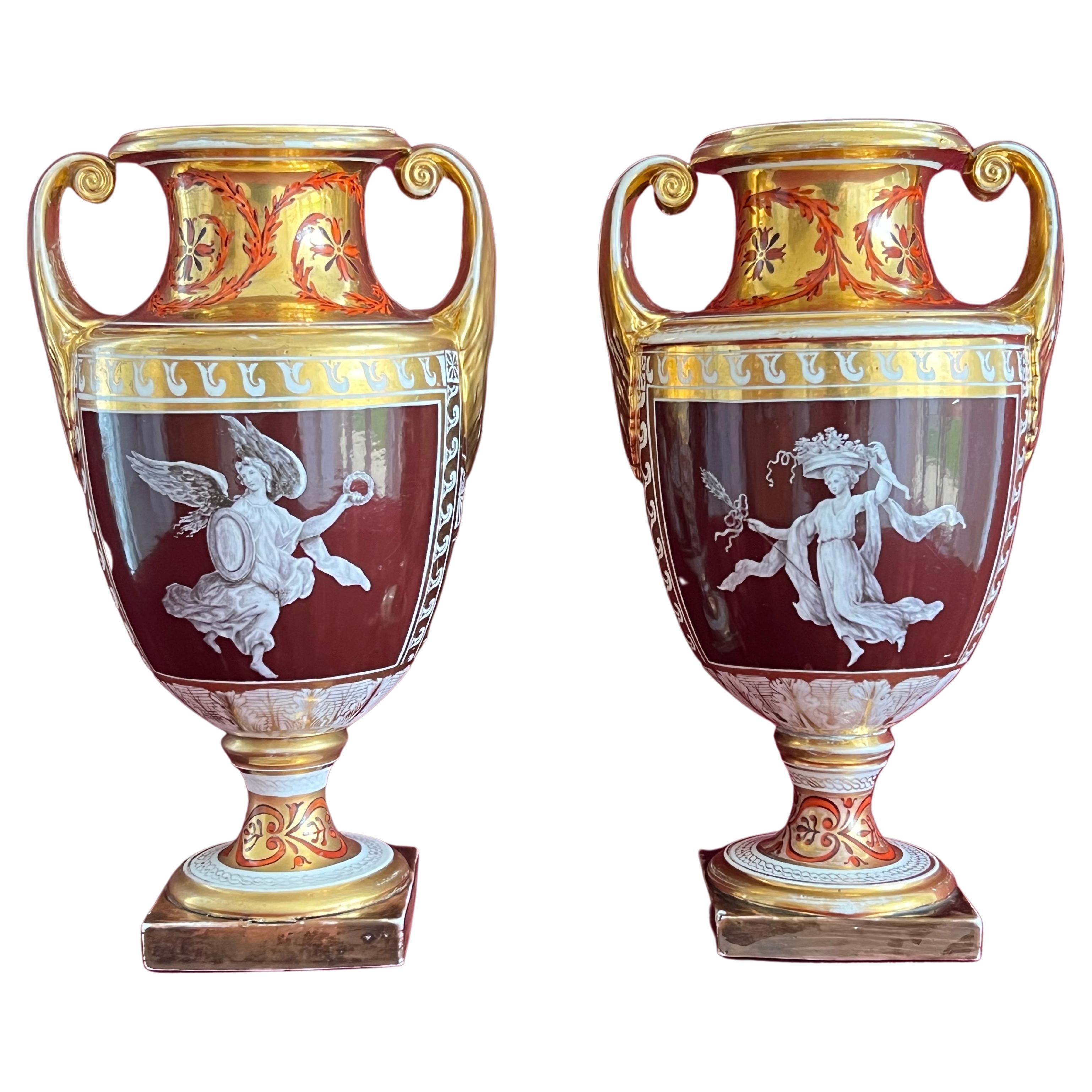 A rare pair of Coalport porcelain vases decorated by Thomas Baxter
