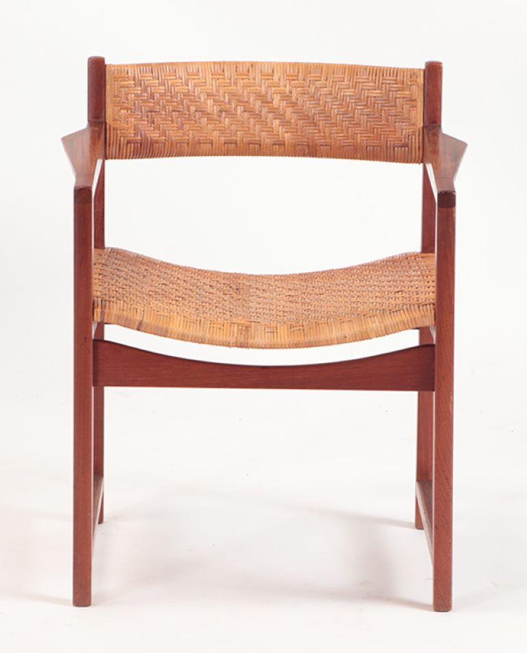 A rare pair of Danish teak armchairs by Hvidt & Molgaard-Nielsen C 1950 having rosewood inset into the arms.