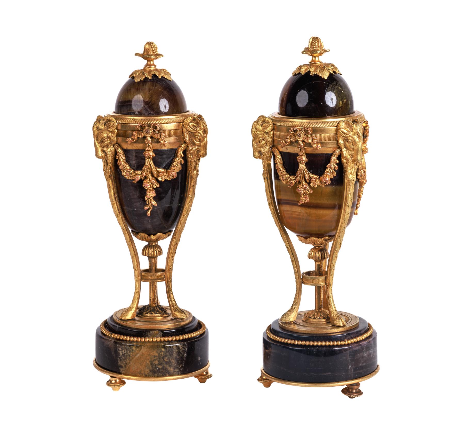 A Rare Pair of French Ormolu-Mounted Blue John Vases / Candlesticks, C. 1870, In the stye of Matthew Boulton.

These rare and extremely elegant garniture vases and covers can be turned into candlesticks by simply take the tops off and flipping them