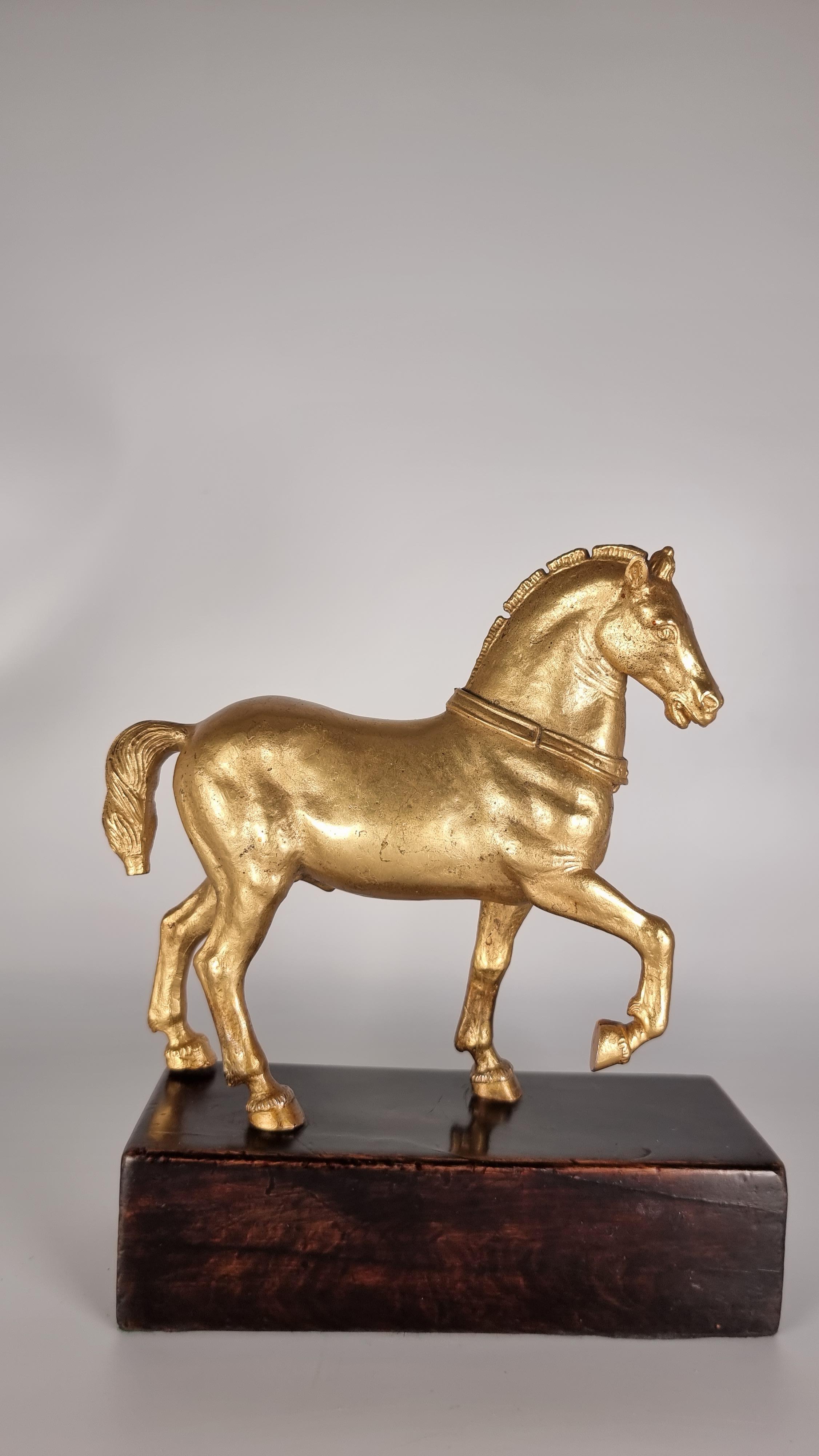 This superb pair of Grand Tour Italian gilt bronzes dates to the late 19th century. They are solid cast and very heavy for their size. They are decorative Grand Tour reproductions taken from the original ones known as the St. Marks Balilica Horses