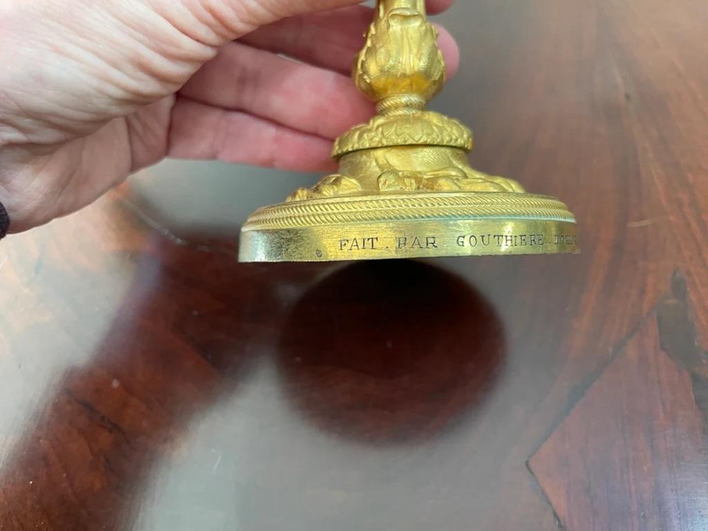 Bronze A rare pair of Louis XV gilt bronze candlesticks signed P. Gouthiere For Sale