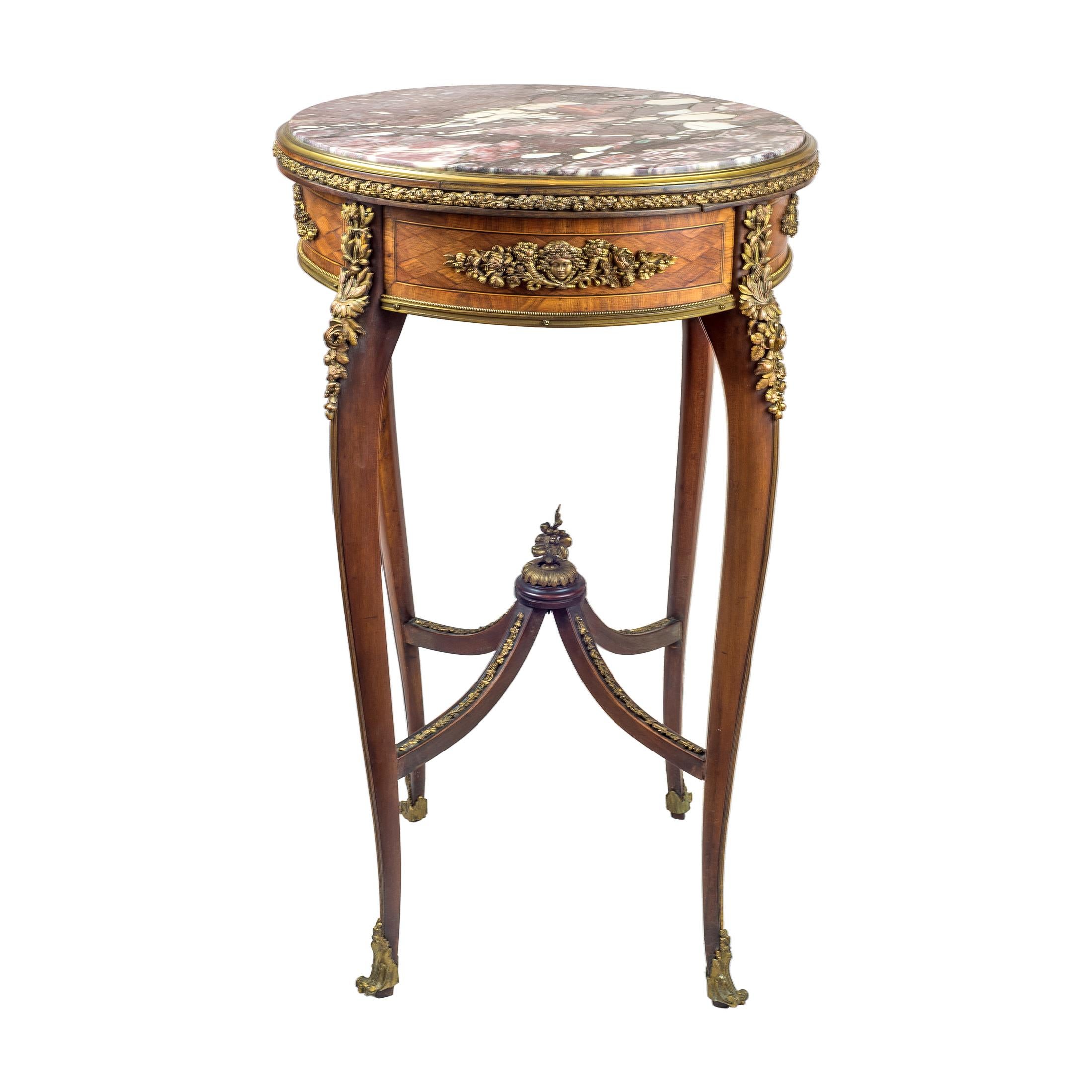 Date: Early 20th century
Origin: French
Dimension: 30 x 18 inches.

This rare and exquisite Louis XV-style guéridon dates to the early 20th century and reflects the exceptional craftsmanship of renowned French cabinetmaker, François Linke