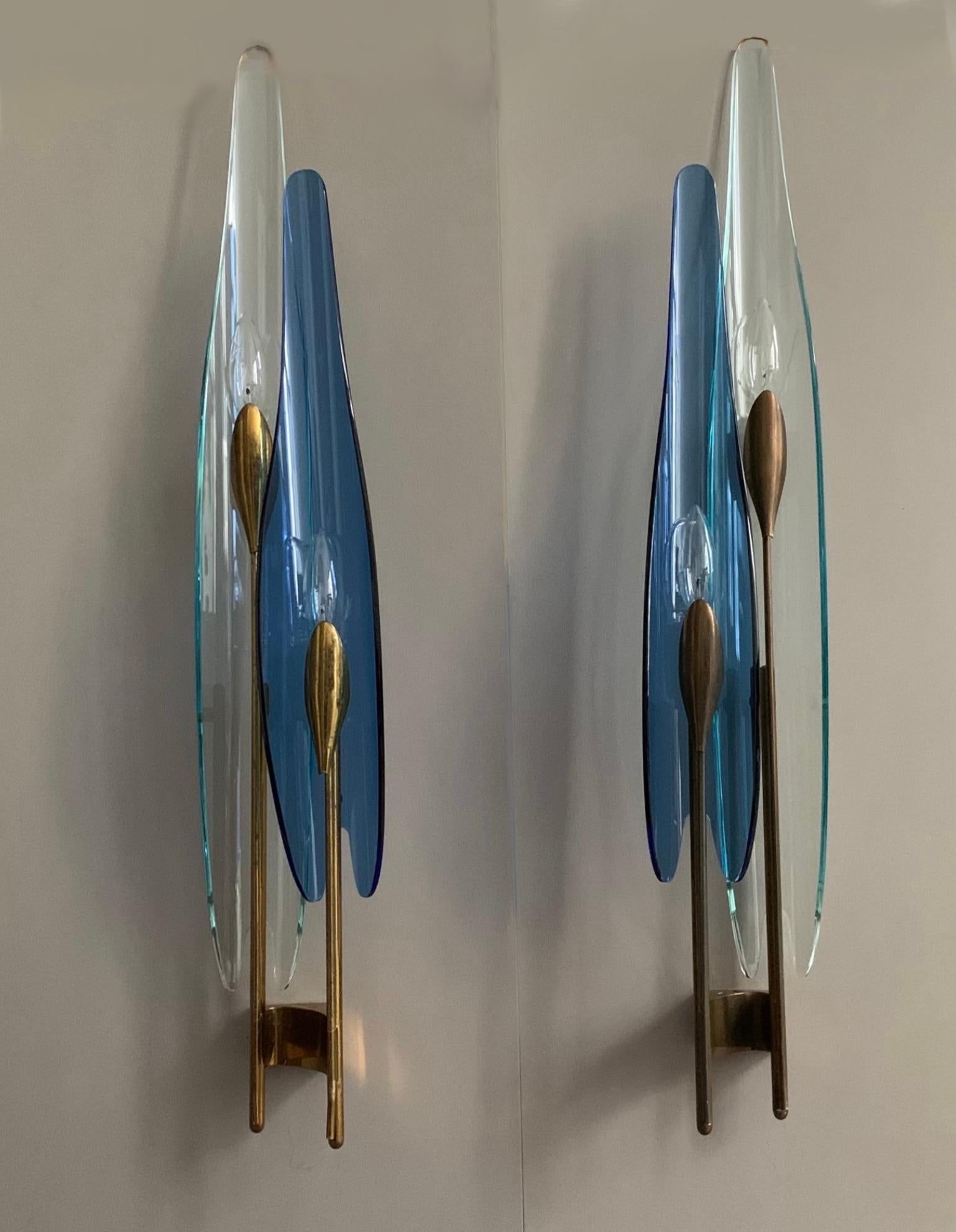 A rare pair of ‘Dahlia’ sconce by Max Ingrand for Fontana Arte. Model #1461. This model includes a rare blue colored glass with clear glass. The sconces are in their original condition. No restoration has been done. All parts are original. Includes