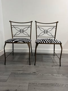 A rare pair of Rene Prou iron chairs in zebra print velvet
