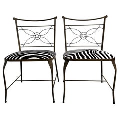 A rare pair of Rene Prou iron chairs in zebra print velvet
